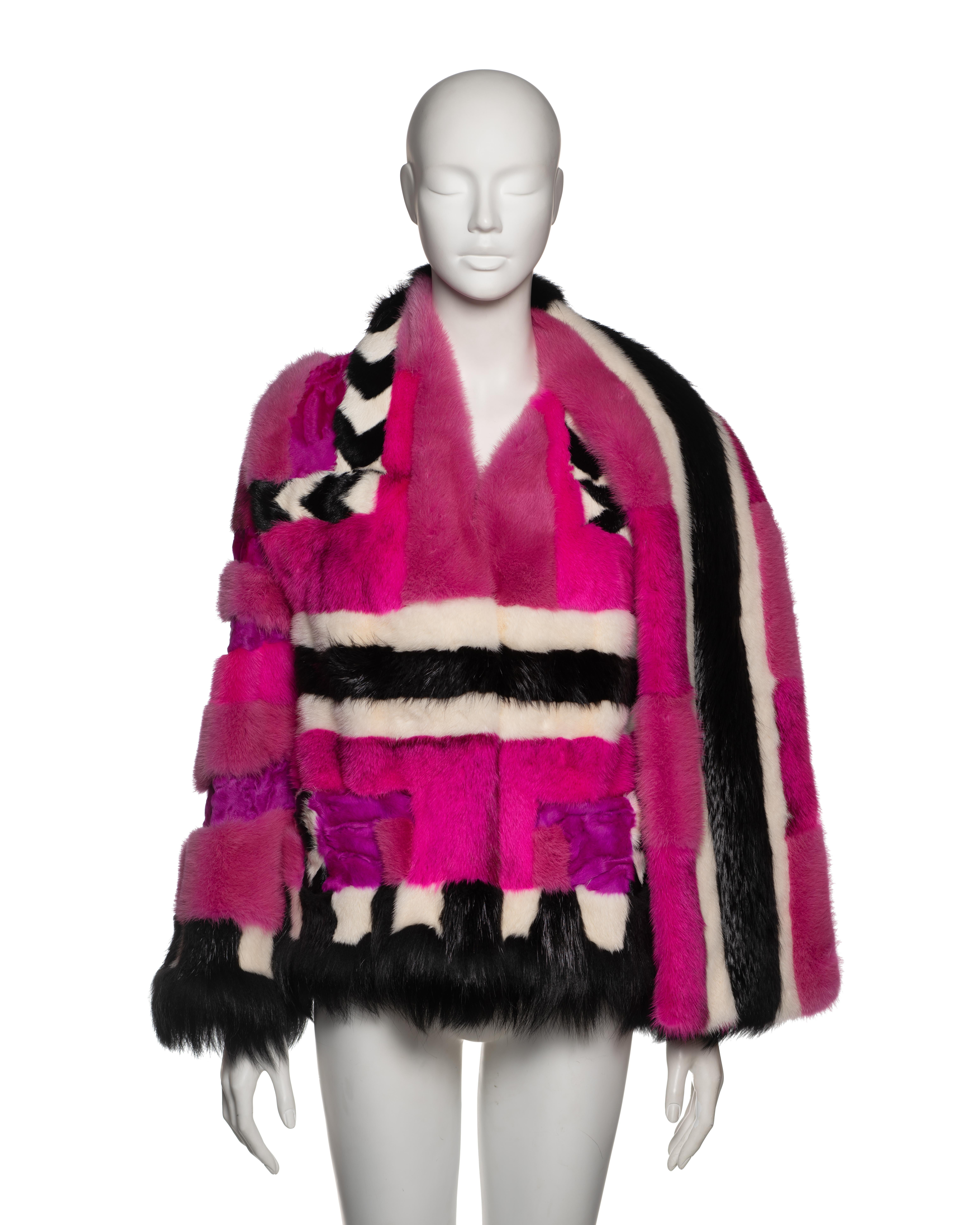 Jacket by Tom Ford from the Fall-Winter 2013 collection, composed of a patchwork of dyed Persian lamb, mink, beaver, and goat fur. The design employs graphic blocking in vivid fuchsia, purple, ivory, and black, arranged in horizontal and chevron