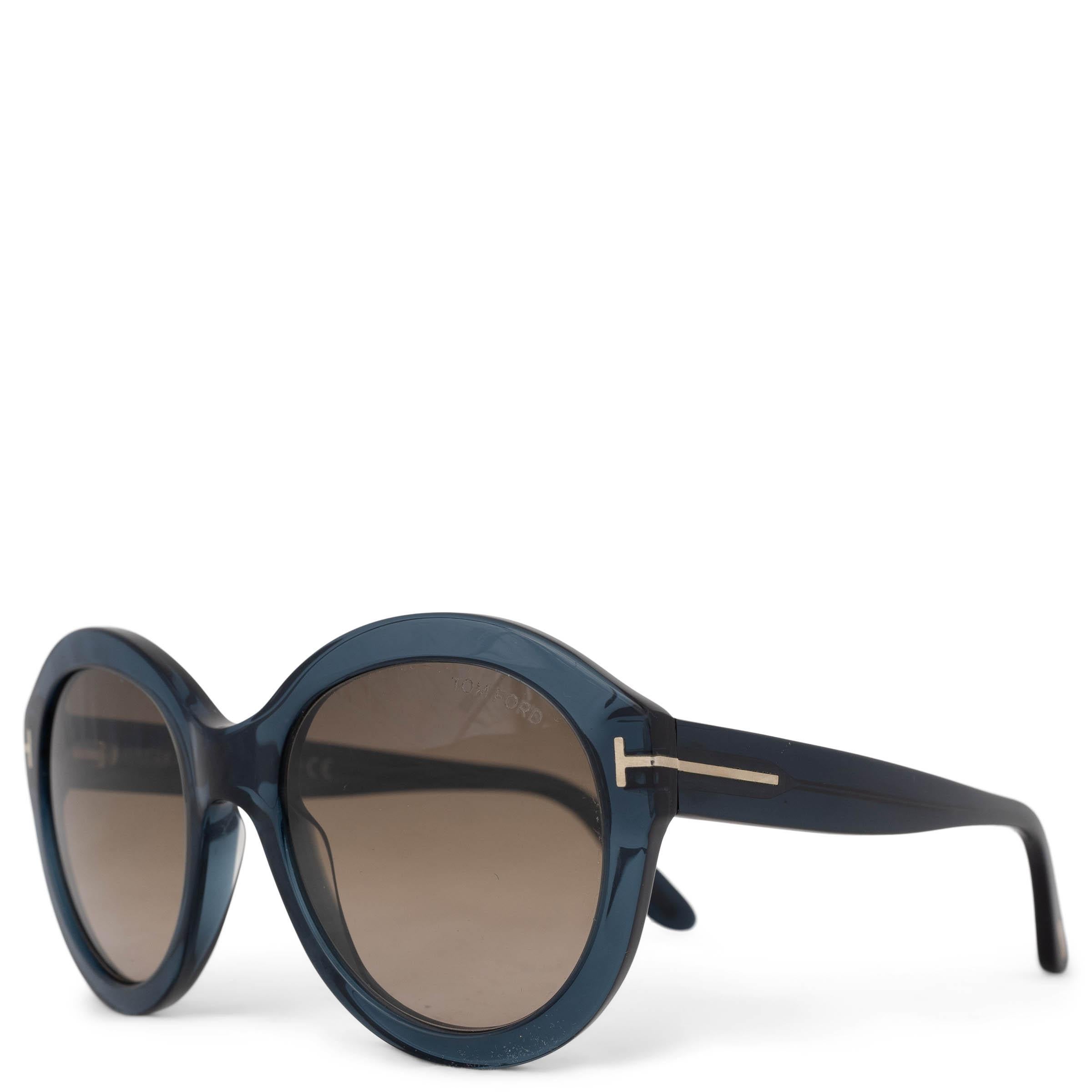 This 100% authentic Tom Ford Kelly 02 sunglasses in petrol acetate exude modern elegance. Featuring brown gradient round lenses and the signature metal T inlays at the temples, they offer a sleek and timeless silhouette. A refined accessory for any