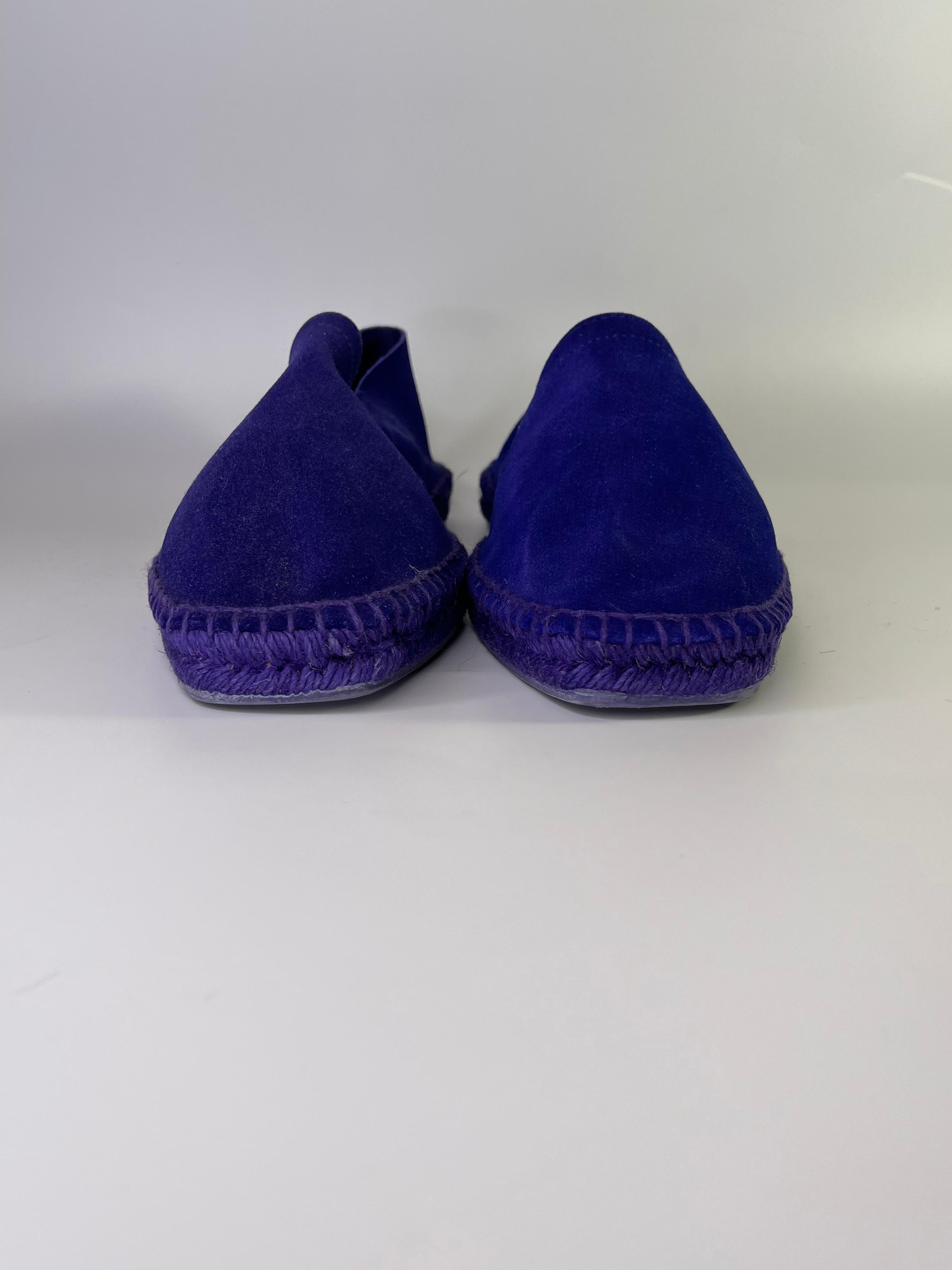 Featuring sueded exterior, solid color, almond toe line, rubber sole, rope hem and a flat under sole.

COLOR: Purple
MATERIAL: Suede
ITEM CODE: J0681T
SIZE: 9 US
COMES WITH: Dust bags & shoe box
CONDITION: Like new - have been tried on.

Made in