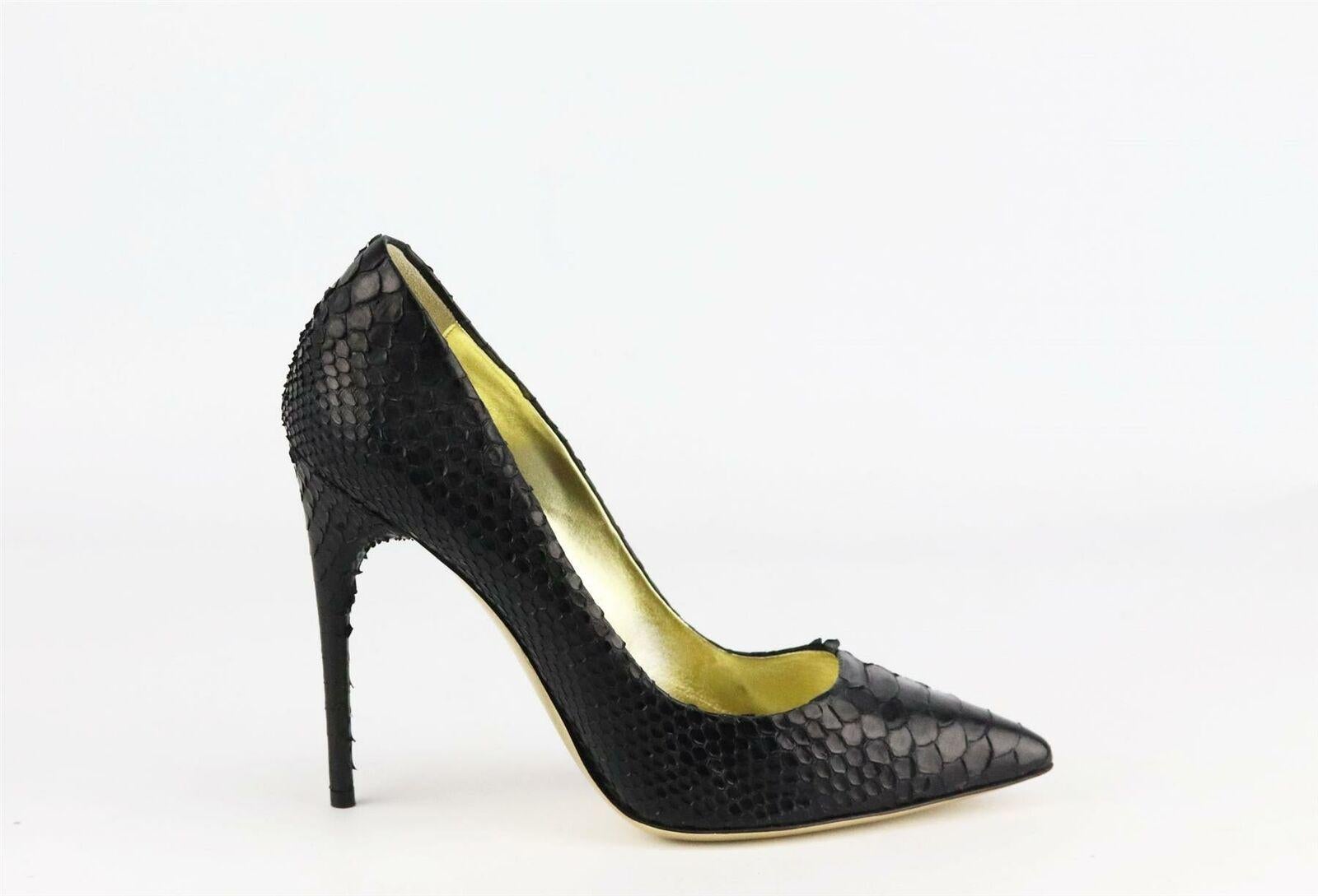 These pumps by Tom Ford have been made in Italy from black python and has elongated pointed toes, they're finished with the brand’s signature gold sole.
Heel measures approximately 101 mm/ 4 inches.
Black python.
Slip on.
Does not come with box or