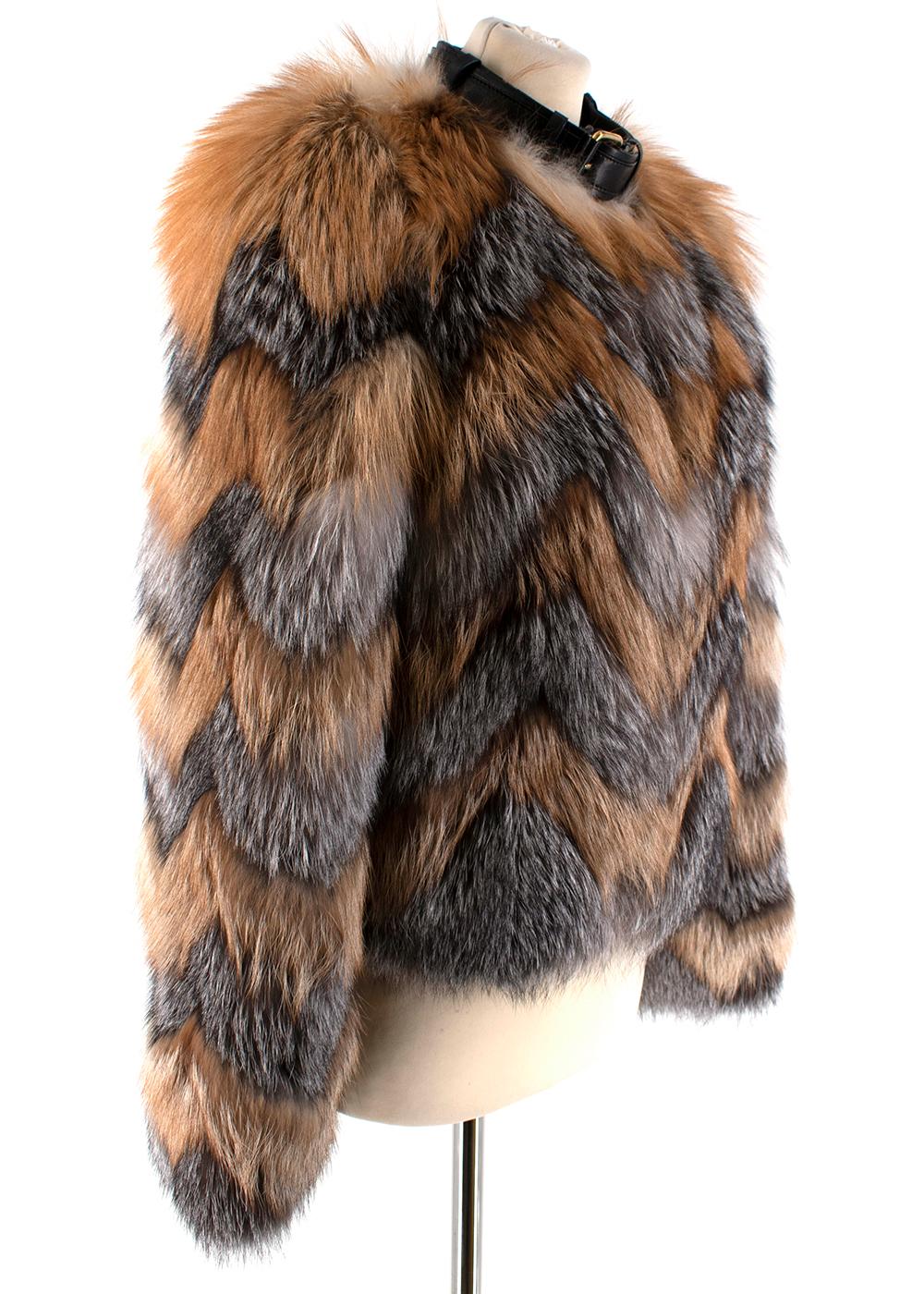 Tom Ford Red & Grey Fox Fur Leather Trimmed Jacket

- Featuring a mixture of soft red fox fur in autumnal shades of orange and cream/grey tones
- Lambskin leather neckline with gold hardware clasps
- Long sleeves
- Very warm perfect for the winter
-