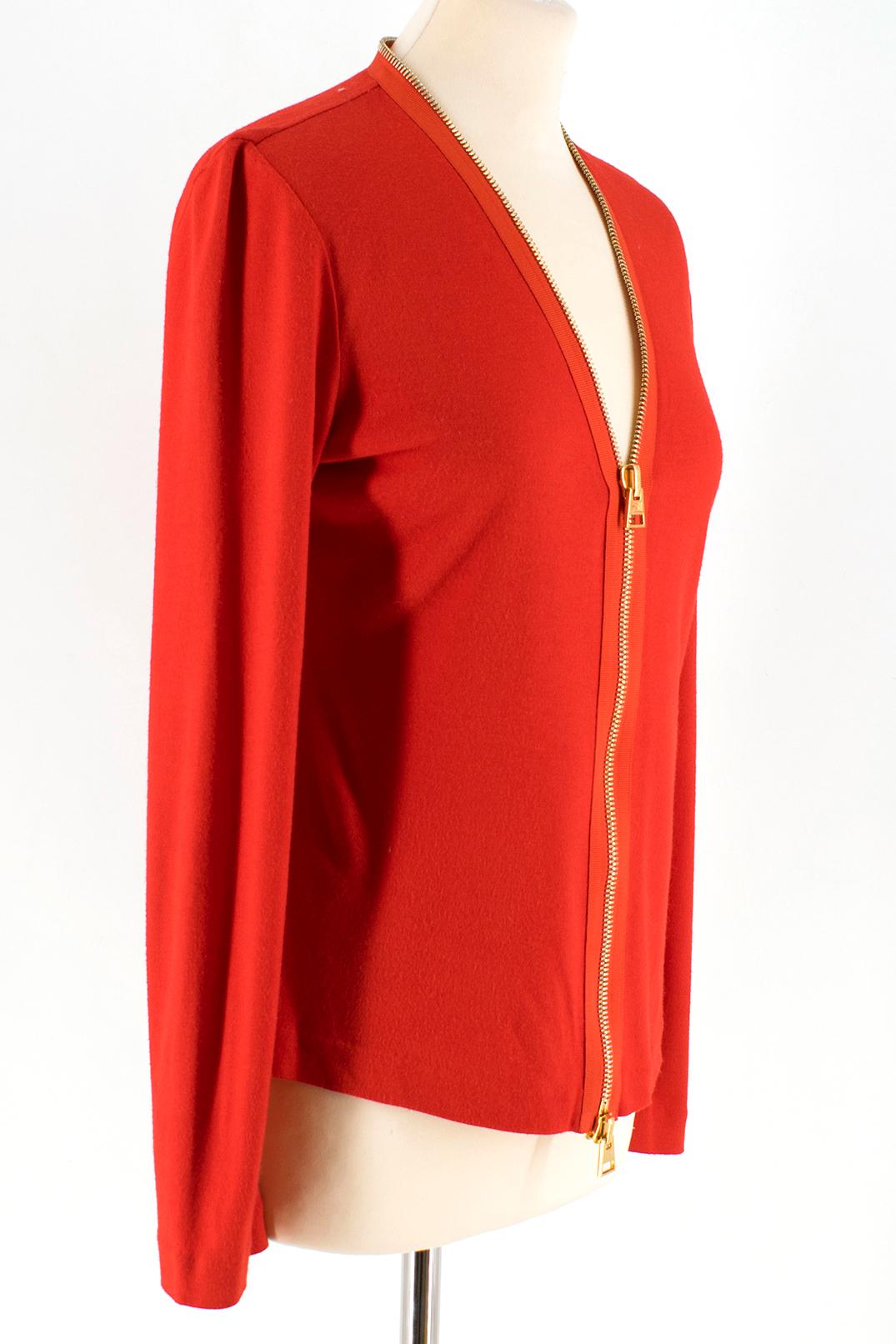 Tom Ford Red Zip Around Cardigan

- red long sleeve top
- golden ton zip fastening to the front 
- adjustable v neckline 

Please note, these items are pre-owned and may show some signs of storage, even when unworn and unused. This is reflected
