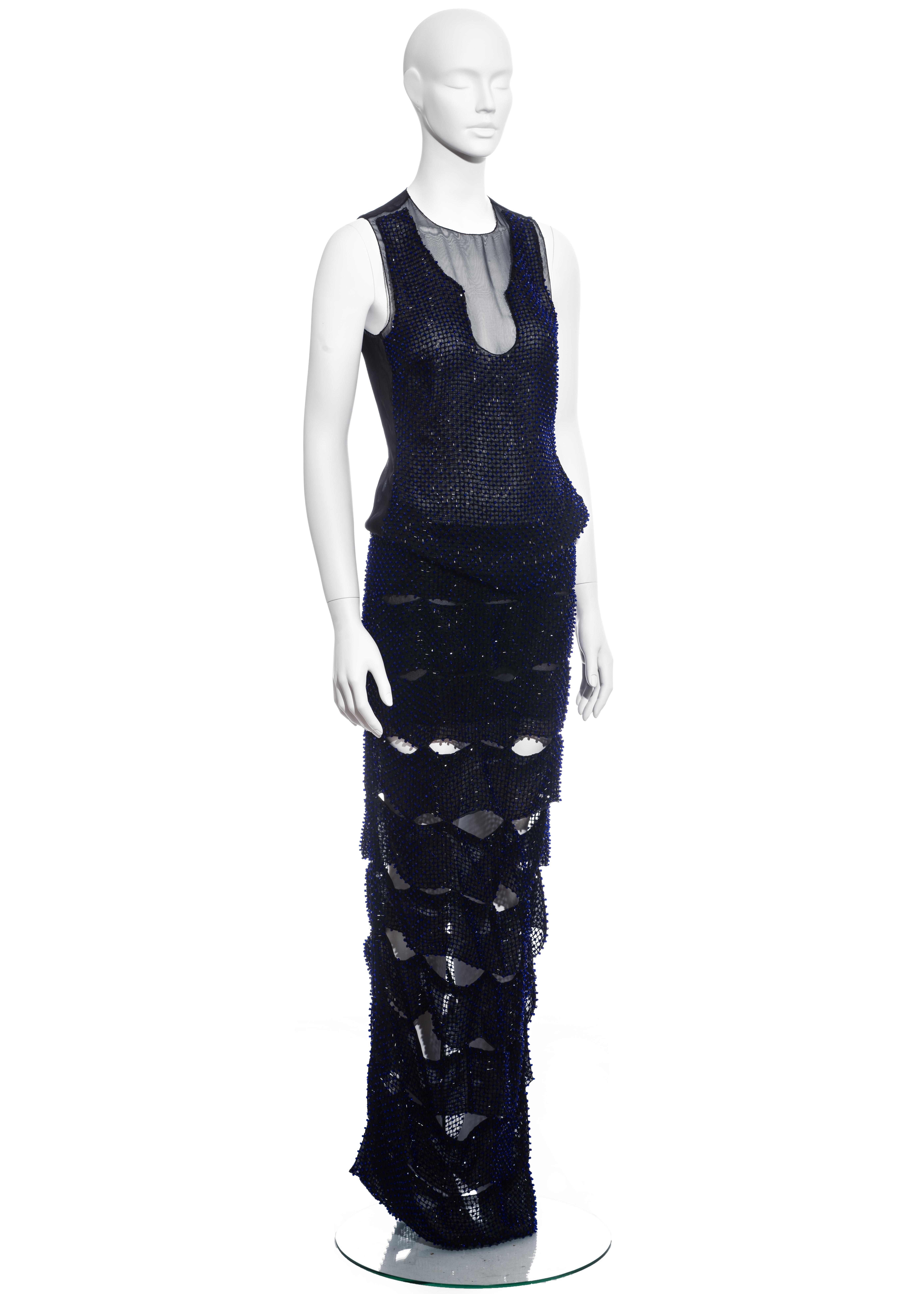 ▪ Evening dress comprising; skirt and top 
▪ Constructed with black silk organza and a lattice of blue glass beads
▪ Skirt formed from pieced strips 
▪ Matching bodice with sheer neckline and back
▪ IT 40 - FR 36 - UK 8 - US 4
▪ Spring-Summer 2013