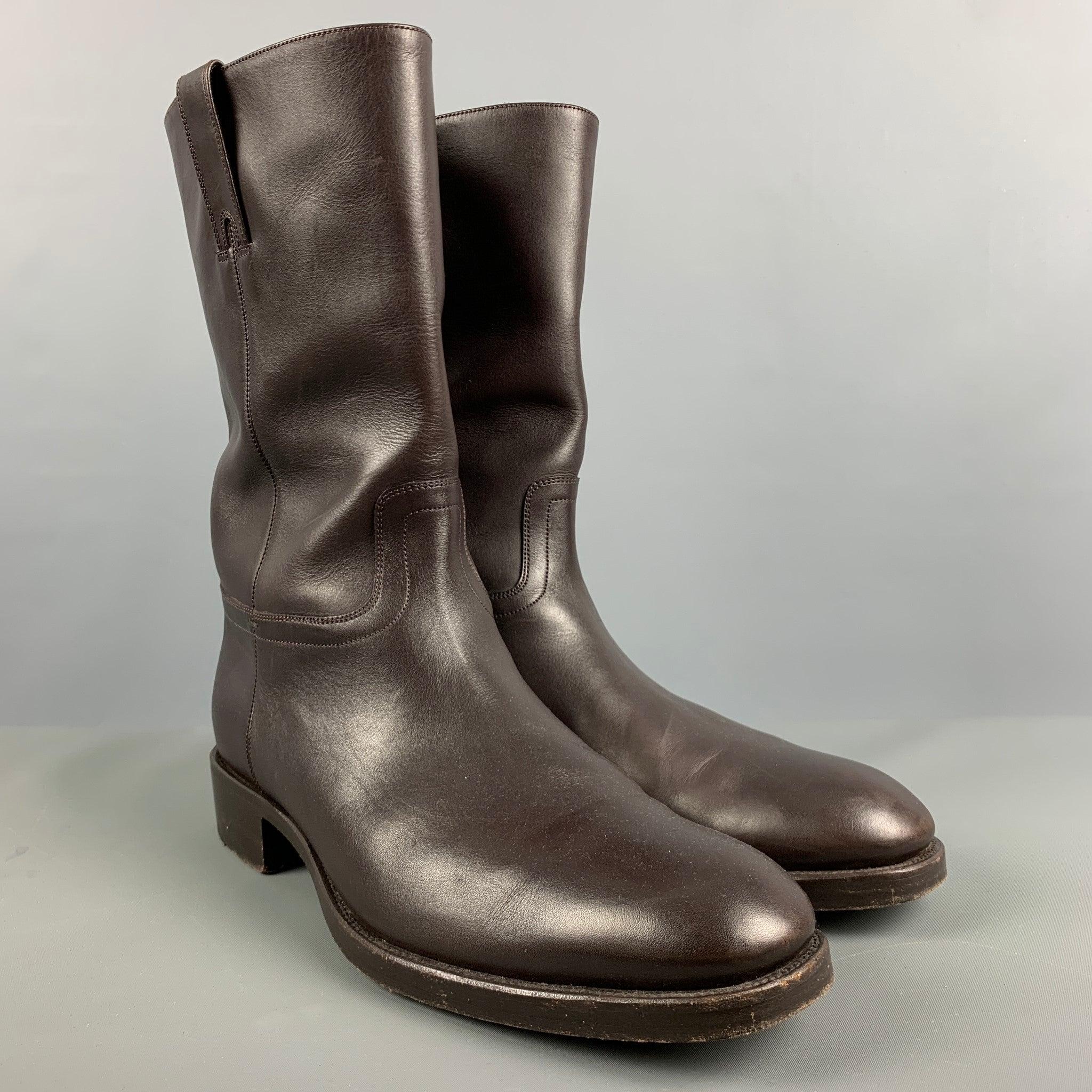TOM FORD boots in a brown leather fabric featuring pull on style, and wooden soles. Made in Italy.Excellent Pre-Owned Condition. 

Marked:   J0 706 T 10 1/2 T 

Measurements: 
  Length: 12 inches Width: 4.25 inches Height: 12 inches 
 
  
  
