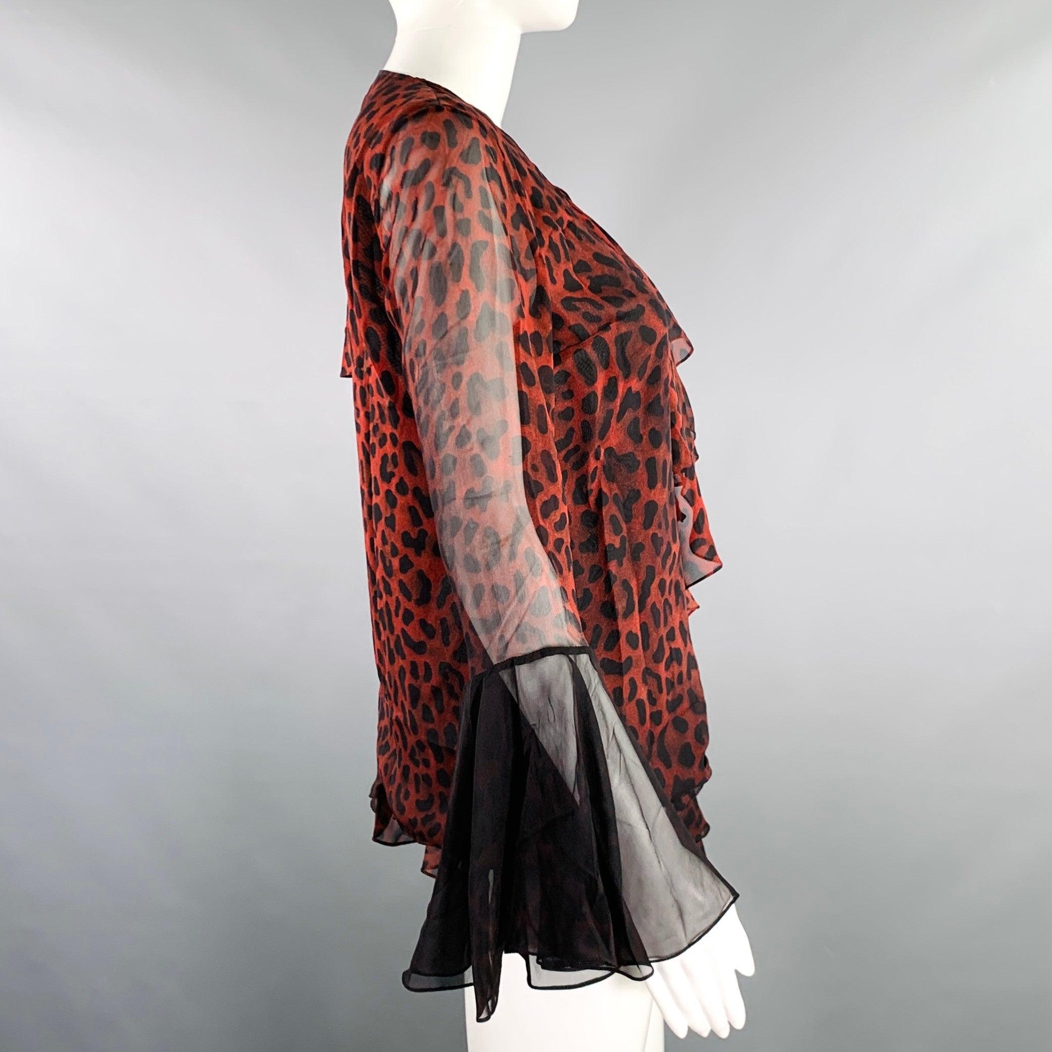 TOM FORD blouse
in a black and burgundy silk featuring an animal print, ruffled front design, and butterfly sleeves. Made in Italy.Excellent Pre-Owned Condition. 

Marked:   IT 40 

Measurements: 
 
Shoulder: 14 inches Bust: 36 inches Sleeve: 23.5