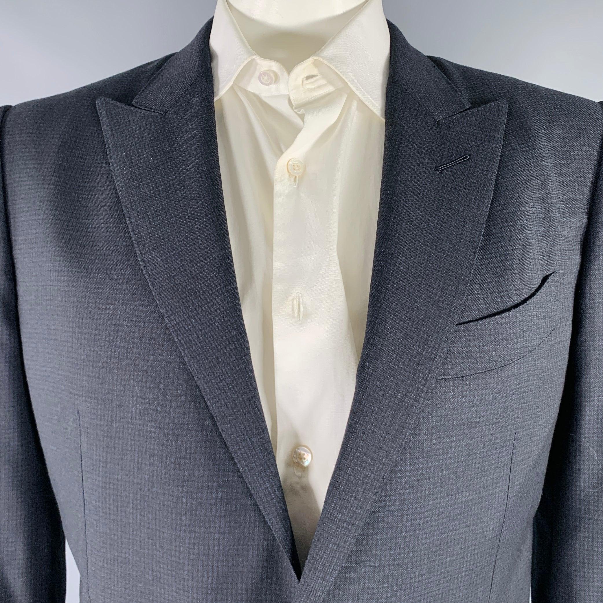 TOM FORD sport coat
in a black and navy wool stretch blend fabric featuring a checkered pattern, peak lapel, double vented back, and double button closure. Made in Italy.Excellent Pre-Owned Condition. 

Marked:   54R 

Measurements: 
 
Shoulder: