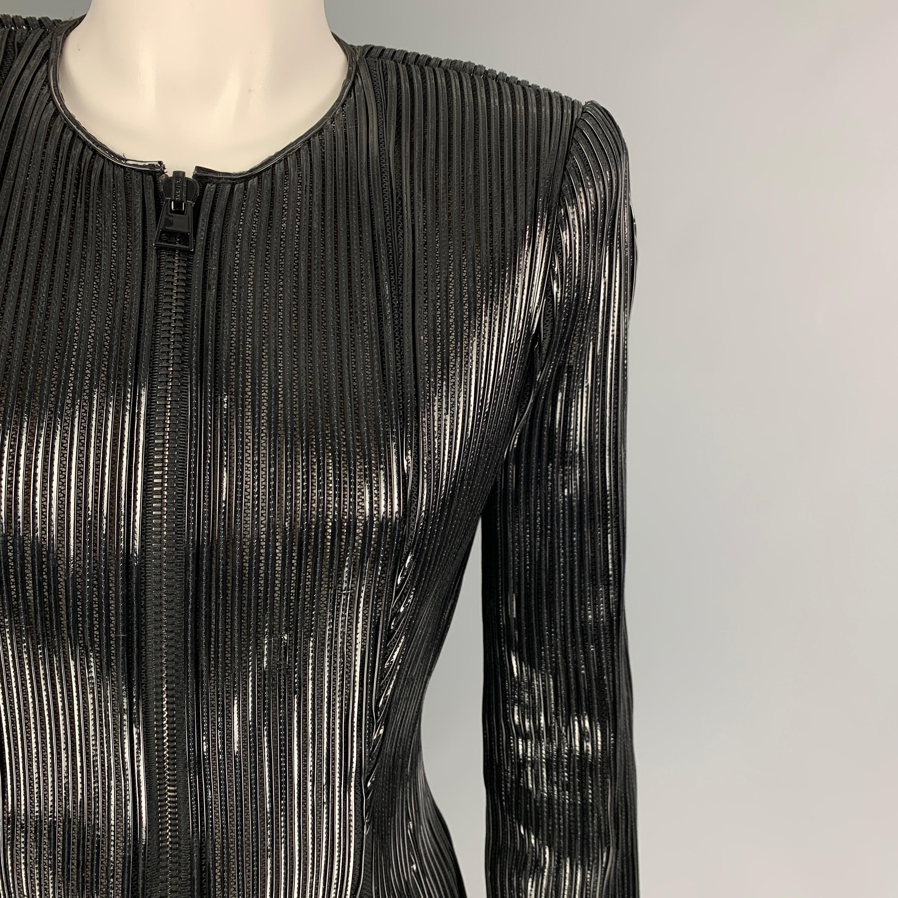 TOM FORD jacket comes in a black silk / cotton featuring a leather ribbed design, collarless, shoulder pads, and a full zip up closure. Made in Italy. 

Excellent Pre-Owned Condition.
Marked: 42

Measurements:

Shoulder: 15.5 in.
Bust: 32