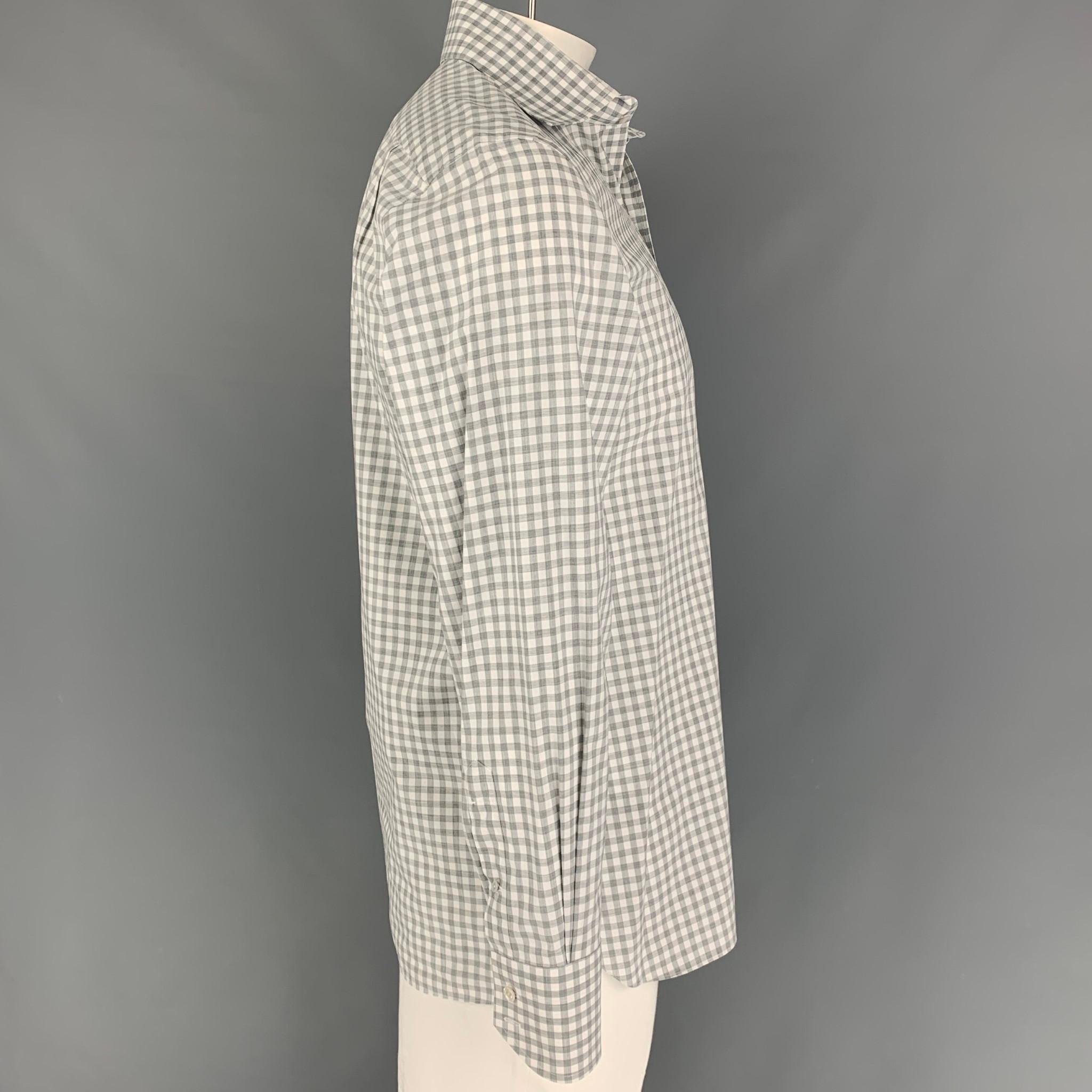TOM FORD long sleeve shirt comes in a light gray gingham cotton featuring a spread collar and a button up closure. Made in Italy. 

Very Good Pre-Owned Condition.
Marked: 41/16

Measurements:

Shoulder: 18 in.
Chest: 42 in.
Sleeve: 26.5 in.
Length:
