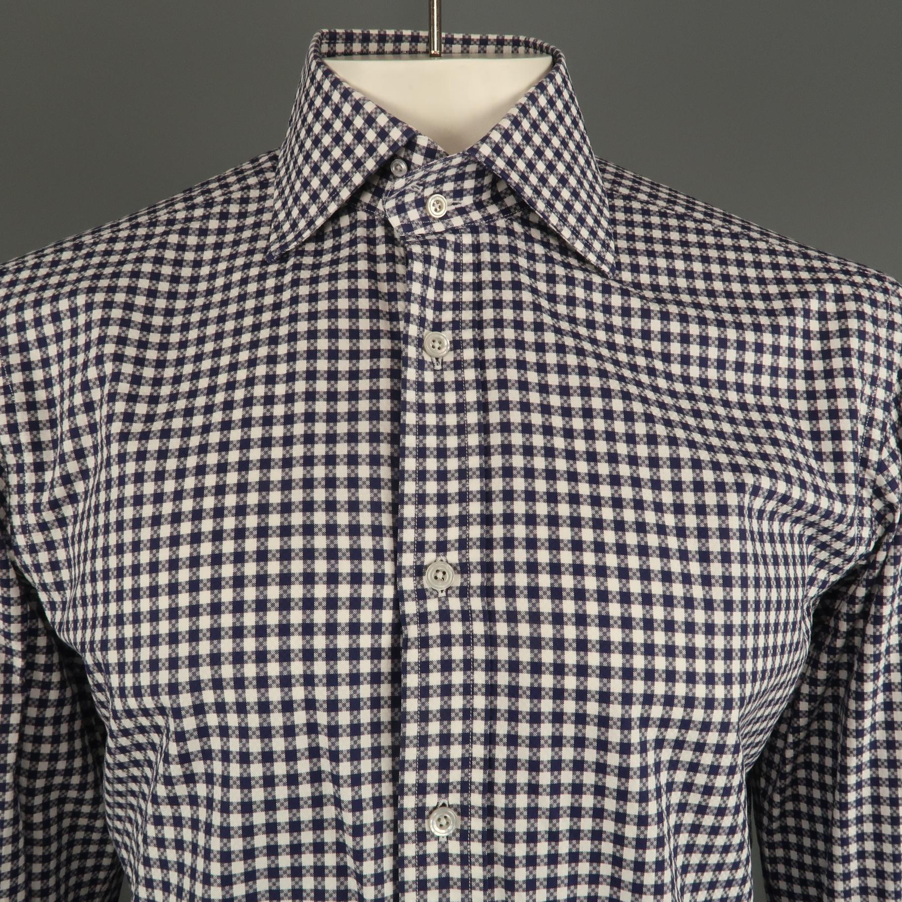 TOM FORD long sleeve shirt comes in a navy and white plaid cotton featuring a button up style and a pointed collar. Made in Italy.
 
Excellent Pre-Owned Condition.
Marked: 42
 
Measurements:
 
Shoulder: 19.5 in.
Chest: 46 in.
Sleeve: 27.5