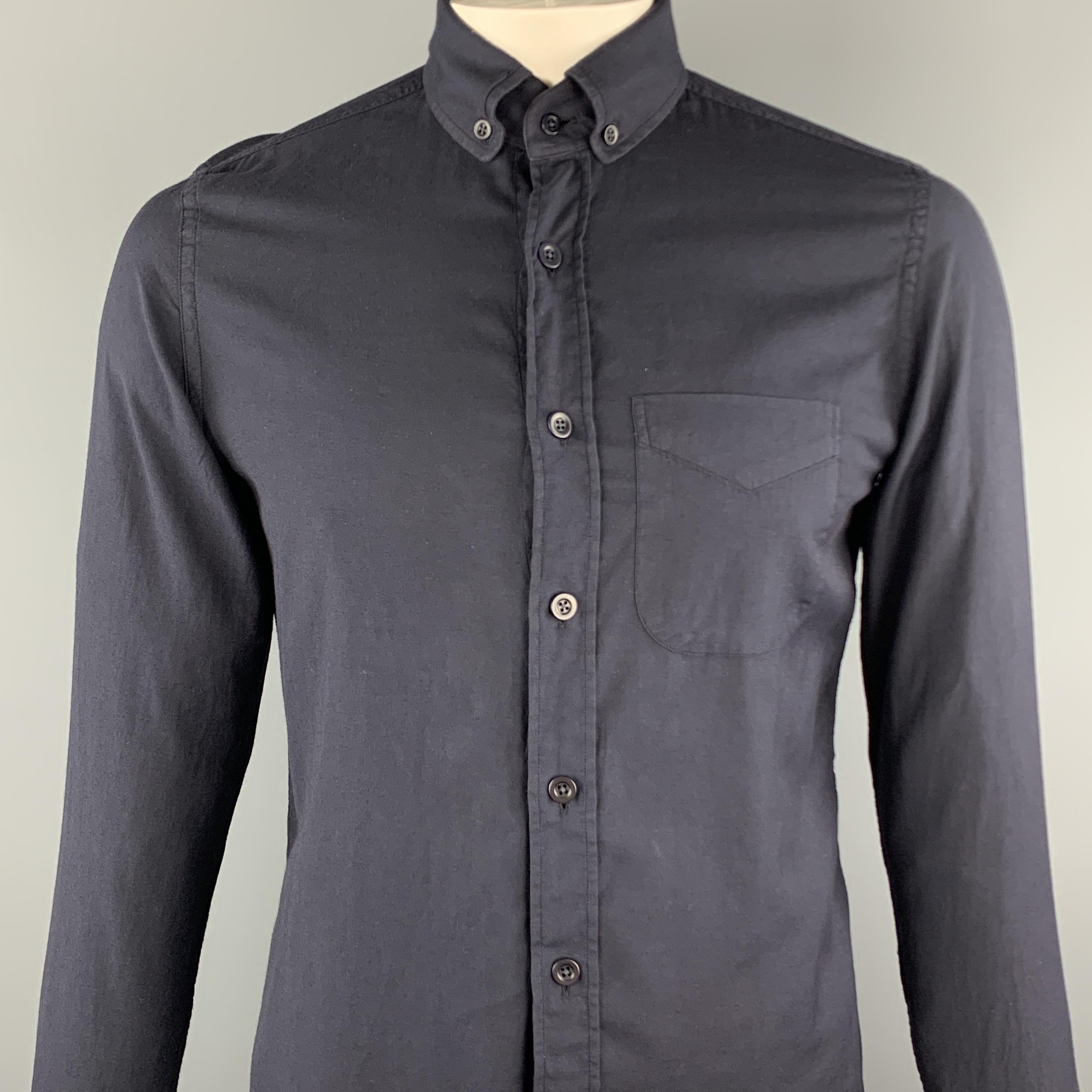 TOM FORD long sleeve shirt comes in a black cotton featuring a button down style and a front patch pocket. 

Excellent Pre-Owned Condition.
Marked: 10 / 15.5

Measurements:

Shoulder: 16 in.
Chest: 40 in.
Sleeve: 28 in.
Length: 31 in.