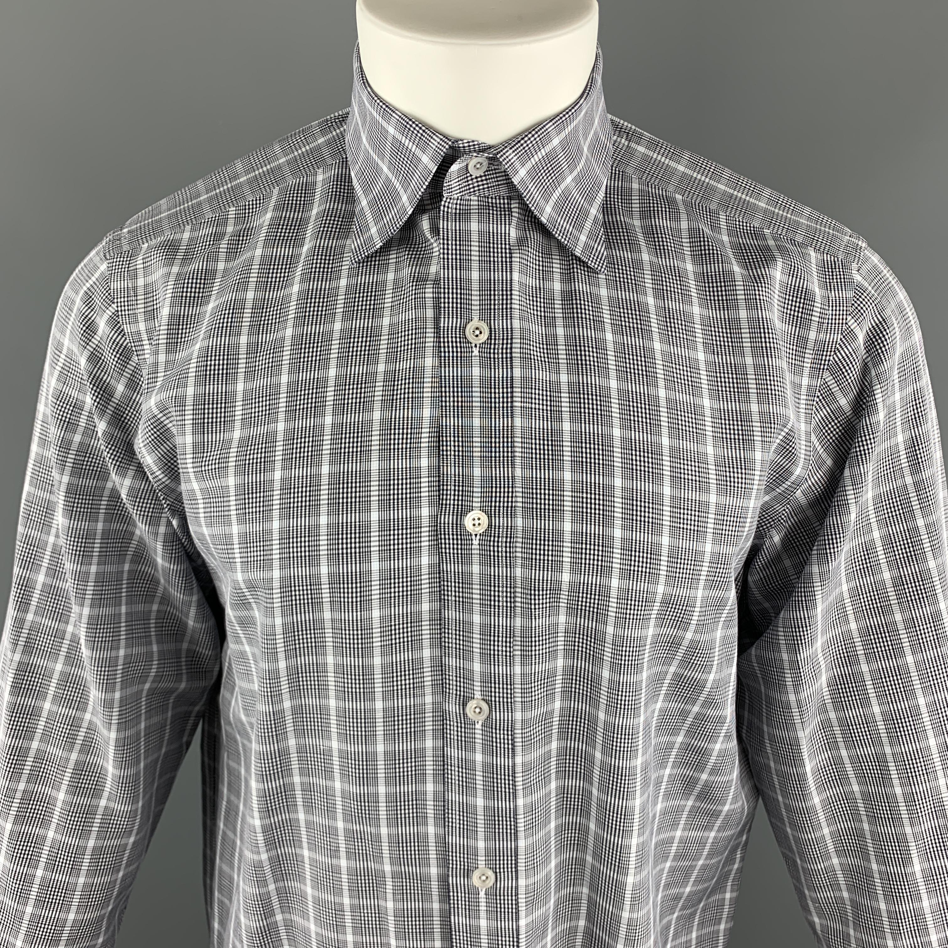 TOM FORD Long Sleeve Shirt comes in blue and grey plaid cotton material, with a pointed collar, double buttoned cuffs, button up. Made in Italy. 

Excellent Good Pre-Owned Condition.
Marked: 40 15 3/4

Measurements:

Shoulder: 17.5 in.
Chest: 42