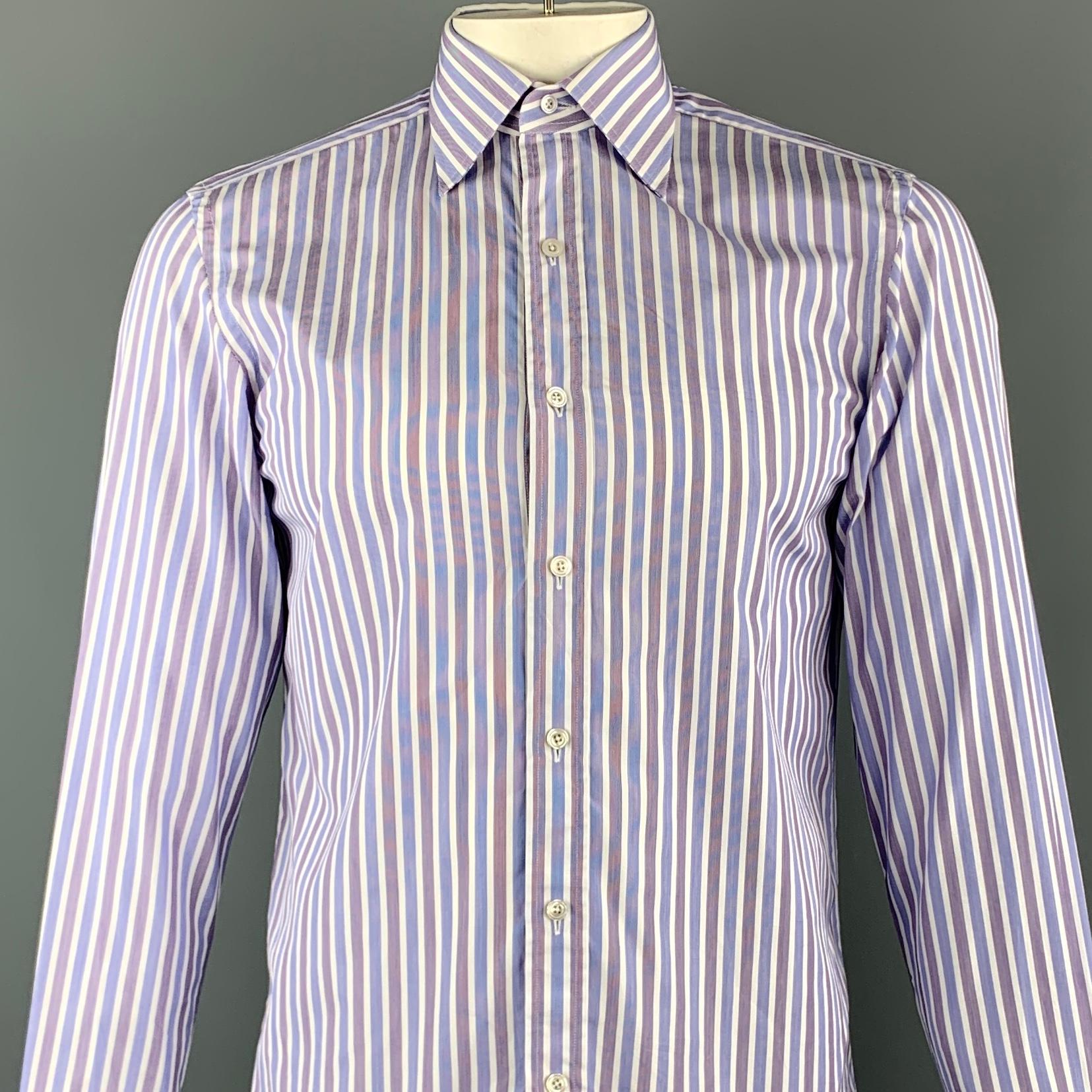 TOM FORD long sleeve shirt comes in a blue and white vertical stripe cotton featuring a button up style, french cuff sleeves, and spread collar. Doesn't come with cufflinks. Made in Switzerland.

Excellent Pre-Owned Condition.
Marked: 39 /