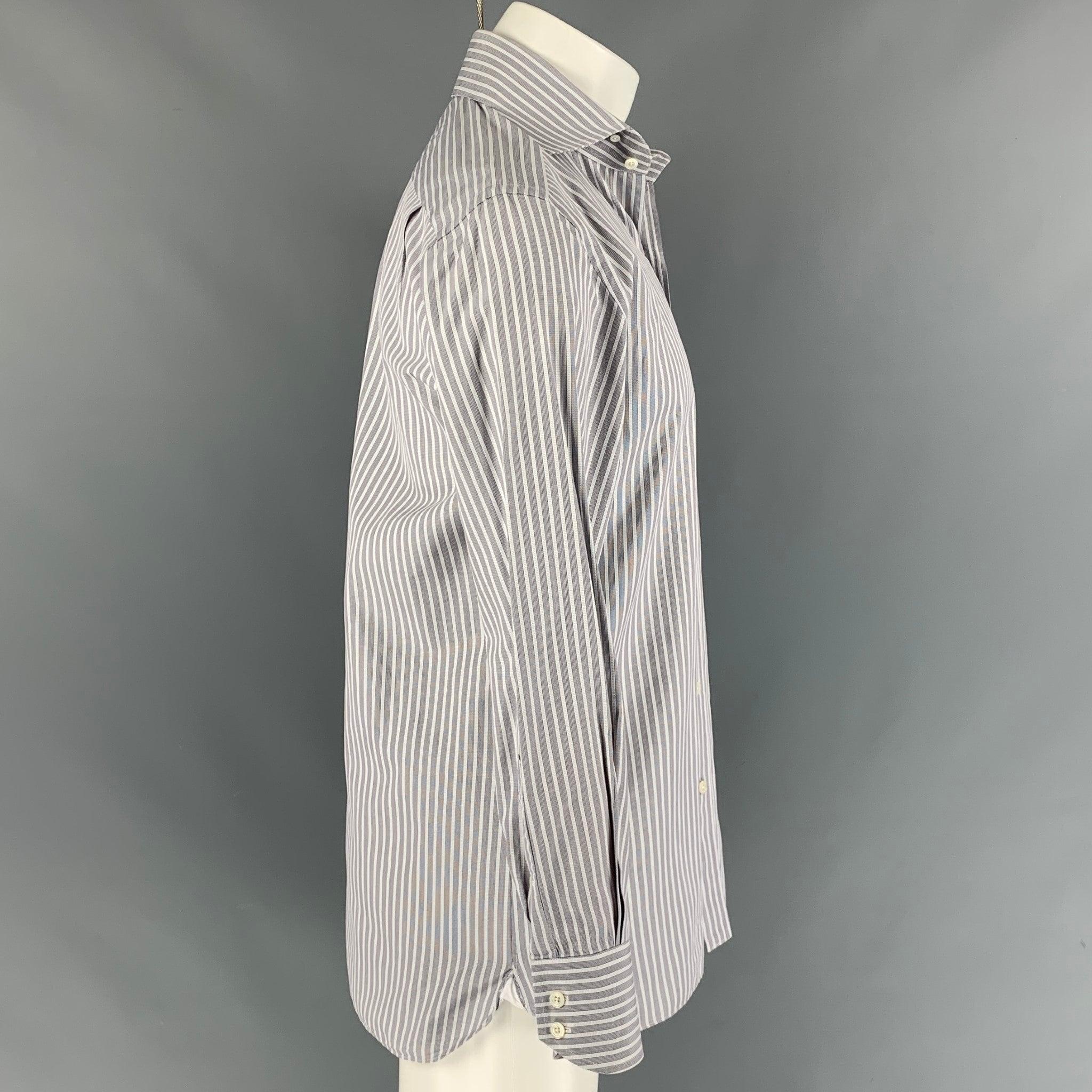 TOM FORD long sleeve shirt comes in a grey striped cotton featuring a spread collar and a buttoned closure. Made in Switzerland.
Excellent
Pre-Owned Condition. 

Marked:   40 - 15 3/4 

Measurements: 
 
Shoulder: 18 inches  Chest: 40 inches  Sleeve: