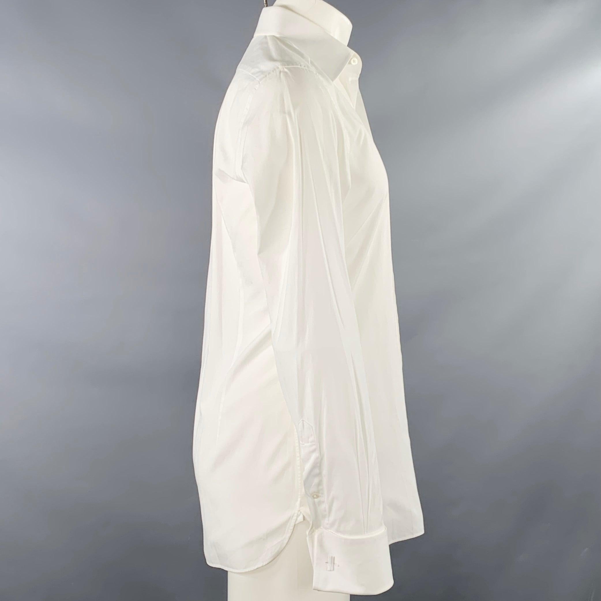 TOM FORD long sleeve shirt in a white cotton woven fabric featuring a curved cutaway collar, French cuffs, and button closure. Cufflinks not included. Made in Italy.Good Pre-Owned Condition. Moderate but hard-to-see marks on sleeve, at collar, and