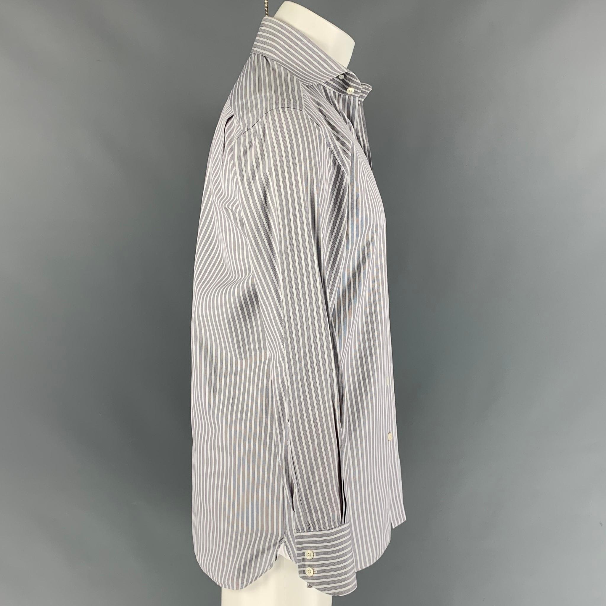 TOM FORD long sleeve shirt comes in a black & white checkered cotton featuring a button up style and a spread collar. Made in Switzerland.

Very Good Pre-Owned Condition.
Marked: 44/ 17.5

Measurements:

Shoulder: 19 in.
Chest: 48 in.
Sleeve: 27