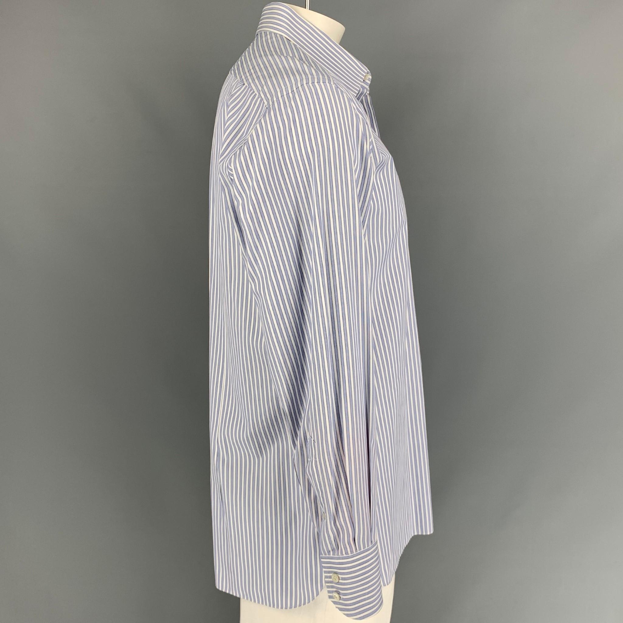 TOM FORD long sleeve shirt comes in a blue & white stripe cotton featuring a pointed collar and a buttoned closure. 

Very Good Pre-Owned Condition.
Marked: 44/17.5

Measurements:

Shoulder: 18.5 in.
Chest: 46 in.
Sleeve: 26.5 in.
Length: 31 in. 

 