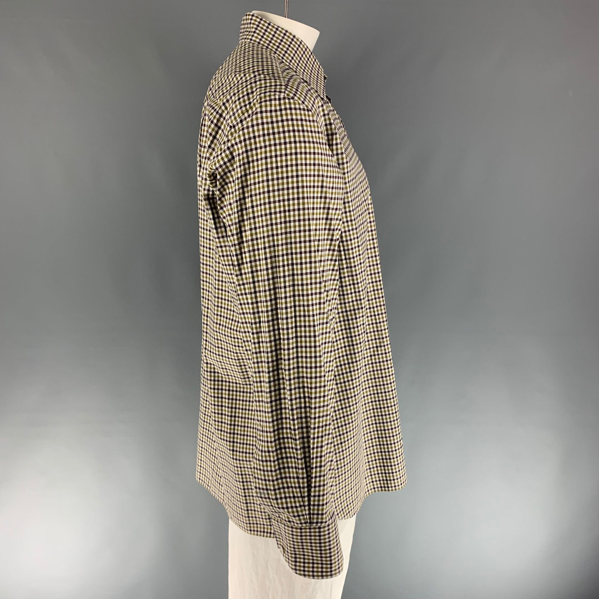 TOM FORD long sleeve button down shirt comes in a green, brown, and white checkered design and a spread collar. 100% cotton.
Very Good Pre-Owned Condition. 

Marked:   44 & 17 1/2
 

Measurements: 
  
Shoulder: 20 inches Chest: 49 inches Sleeve: 27