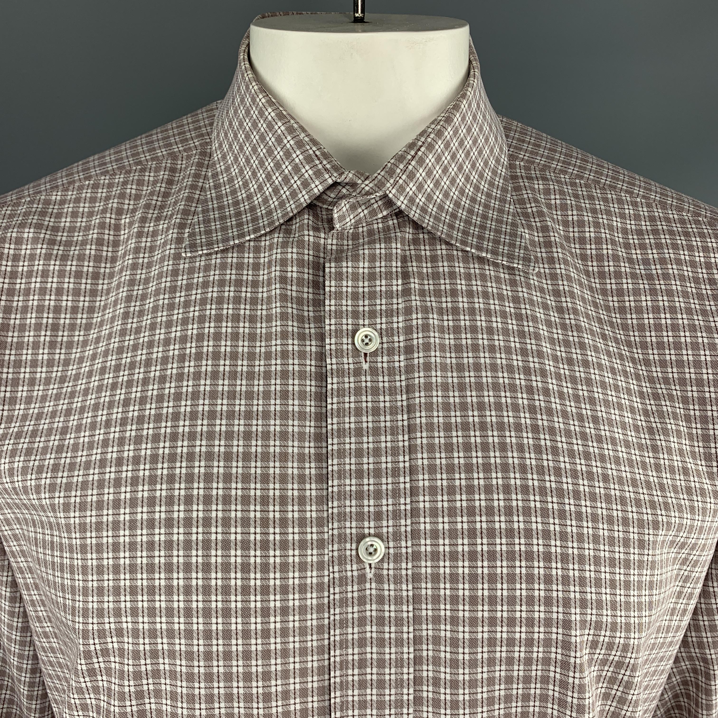 TOM FORD dress shirt comes in white and brown micro plaid cotton with a pointed spread collar and button up front. Made in Italy.

Excellent Pre-Owned Condition.
Marked: 44/17.5

Measurements:

Shoulder: 18.5 in.
Chest: 50 in.
Sleeve: 27 in.
Length: