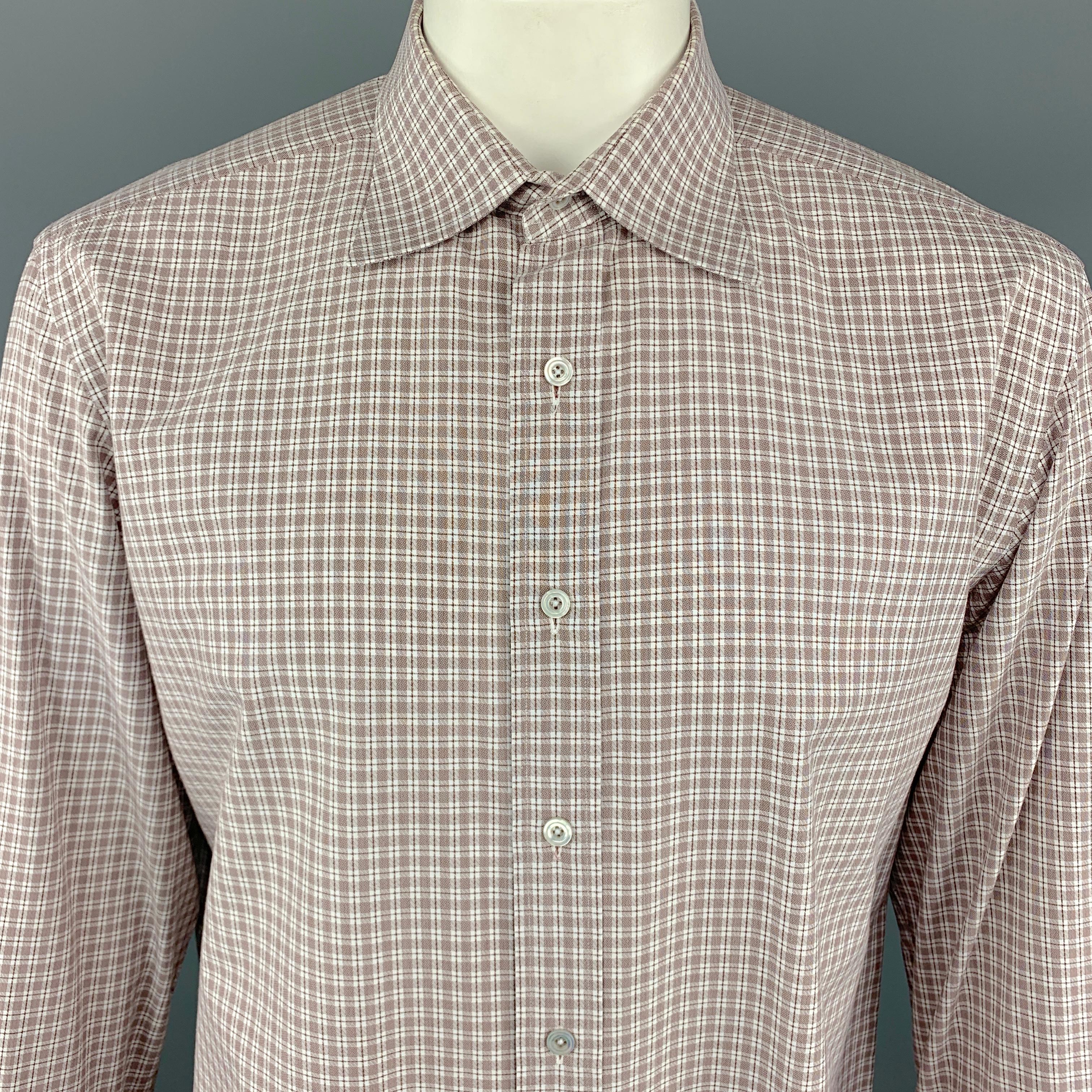 TOM FORD dress shirt comes in white and brown tones in a micro plaid cotton with a pointed spread collar, buttoned cuffs, and button up front. Made in Italy.

Excellent Pre-Owned Condition.
Marked: 44/17.5

Measurements:

Shoulder: 18.5 in.
Chest: