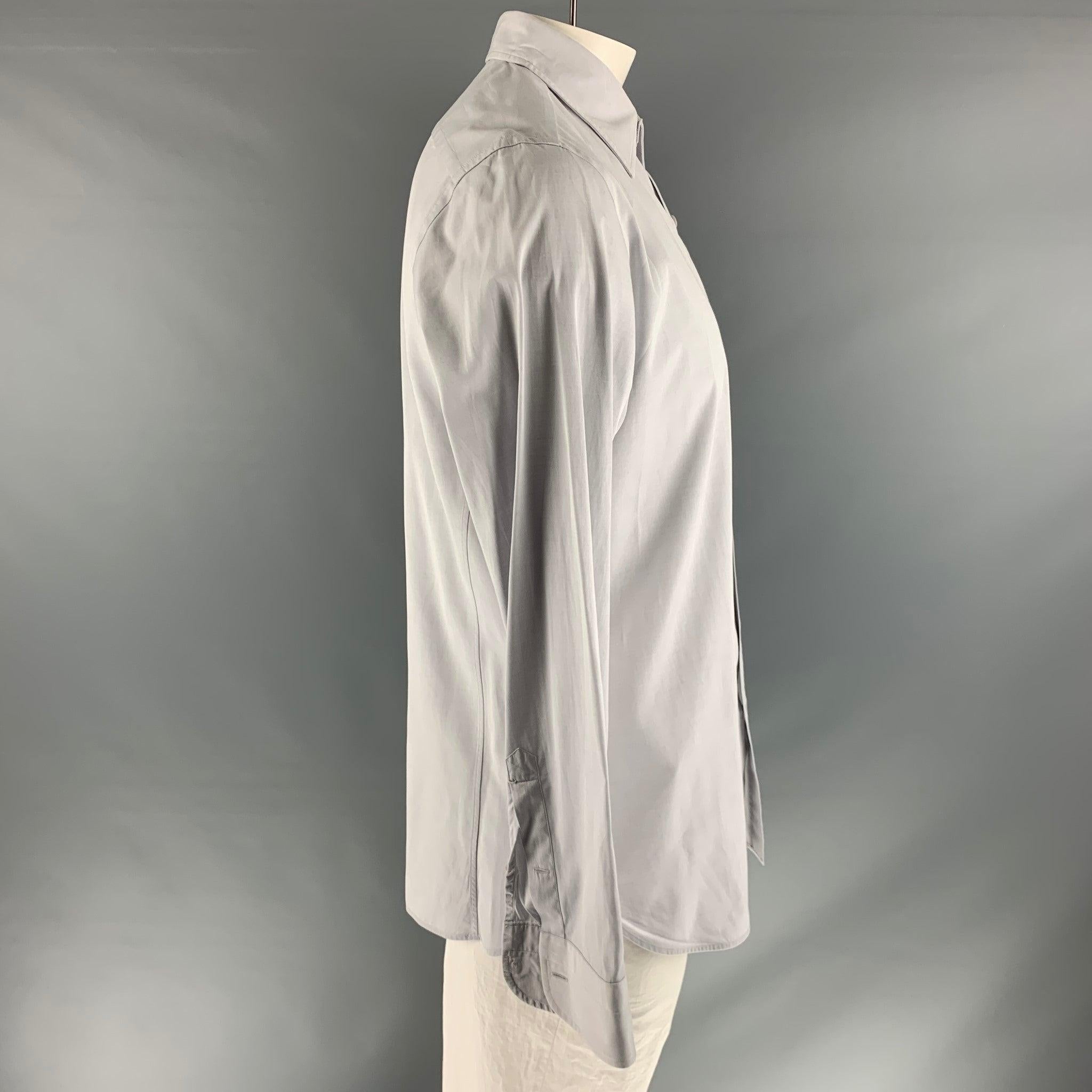 TOM FORD long sleeve shirt comes in a grey 100% cotton featuring a spread collar and button down closure. Made in Italy.Very Good Pre-Owned Condition. 

Marked:   43 & 17 

Measurements: 
 
Shoulder: 18 inches Chest: 46 inches Sleeve: 27 inches
