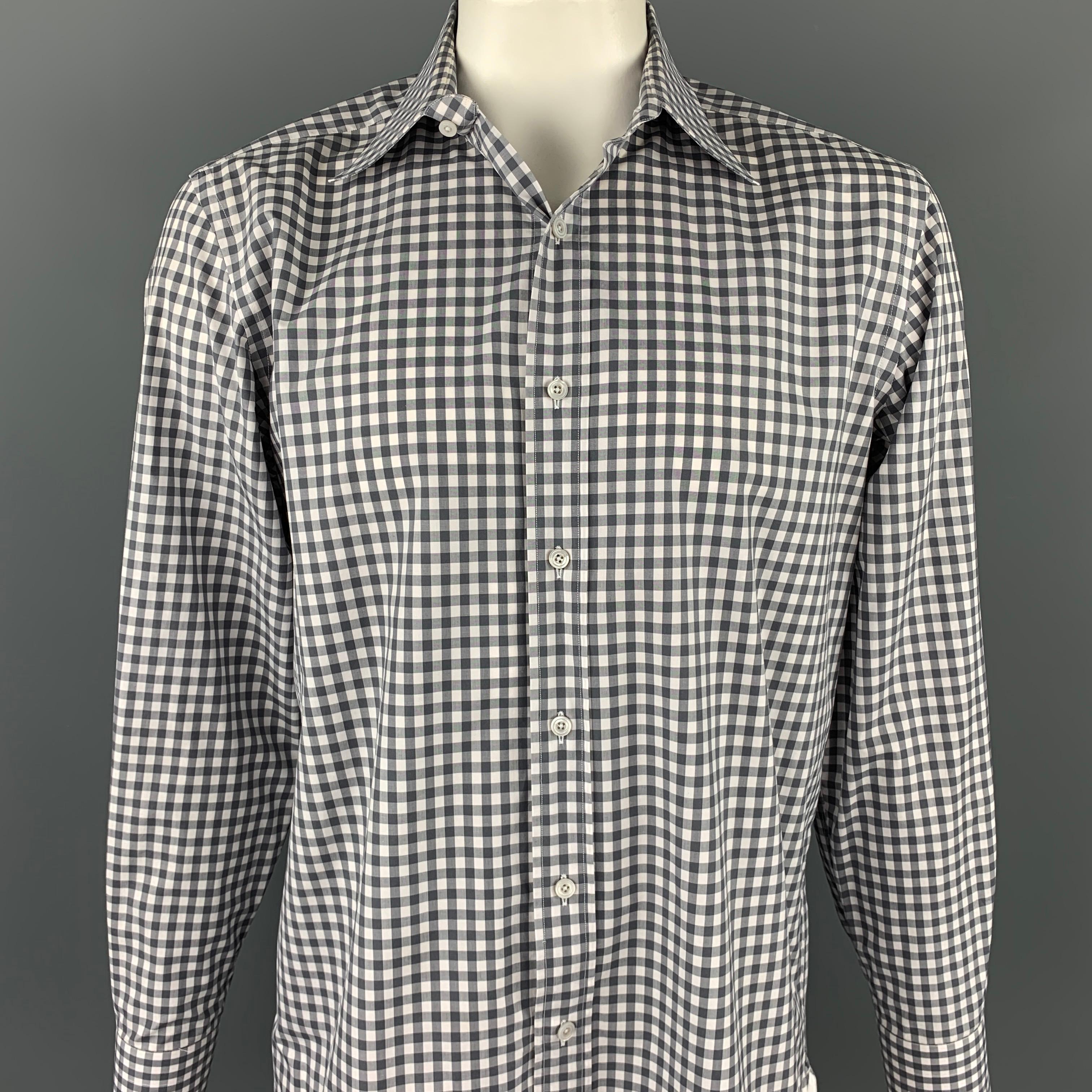 TOM FORD long sleeve shirt comes in a grey & white checkered cotton featuring a button up style and a spread collar. Made in Italy.

Very Good Pre-Owned Condition.
Marked: 43/17

Measurements:

Shoulder: 19 in.
Chest: 48 in.
Sleeve: 27 in.
Length: