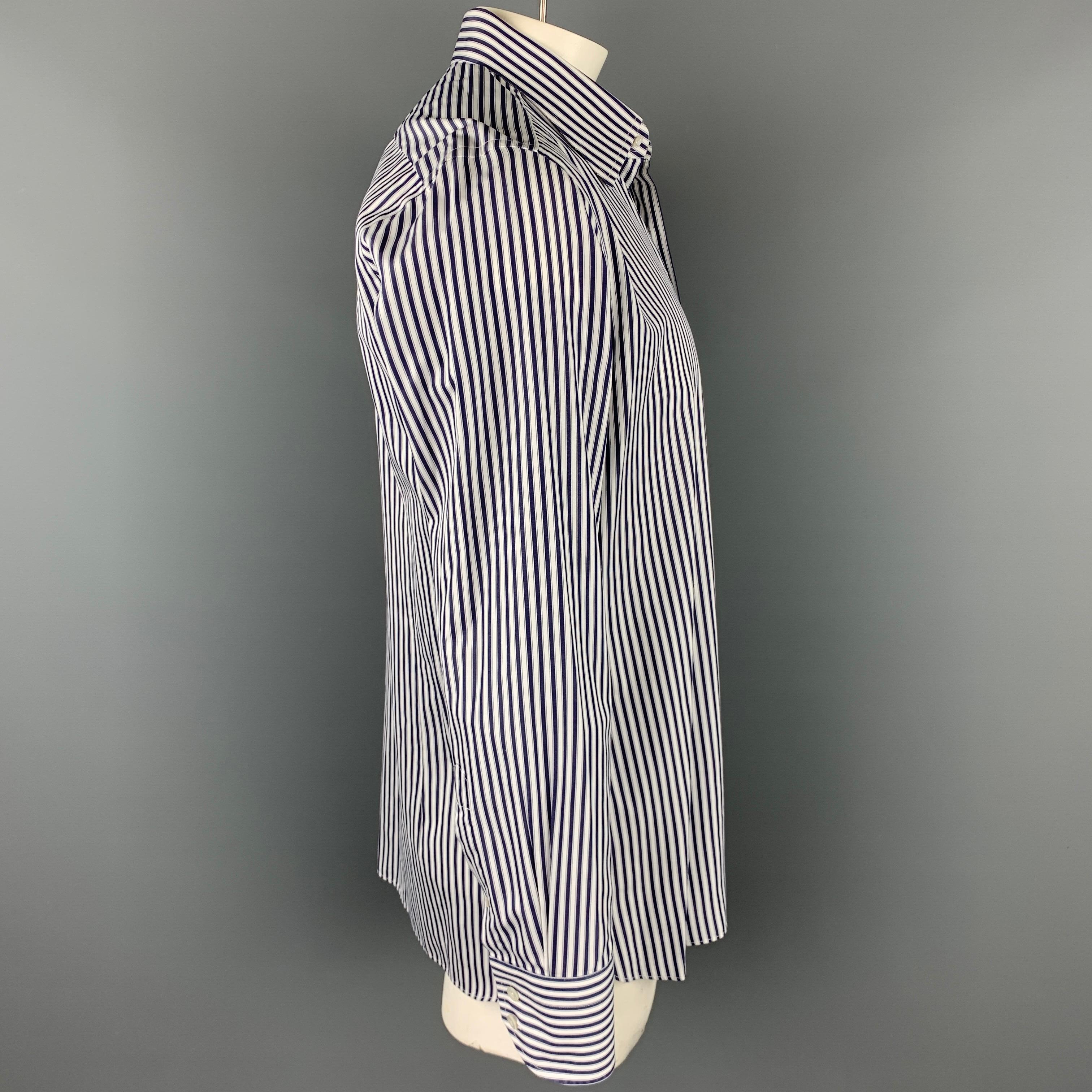 TOM FORD long sleeve shirt comes in a navy & white vertical stripe cotton featuring a button up style and a spread collar. Made in Italy.

Very Good Pre-Owned Condition.
Marked: 44/17.5

Measurements:

Shoulder: 19 in.
Chest: 48 in.
Sleeve: 27