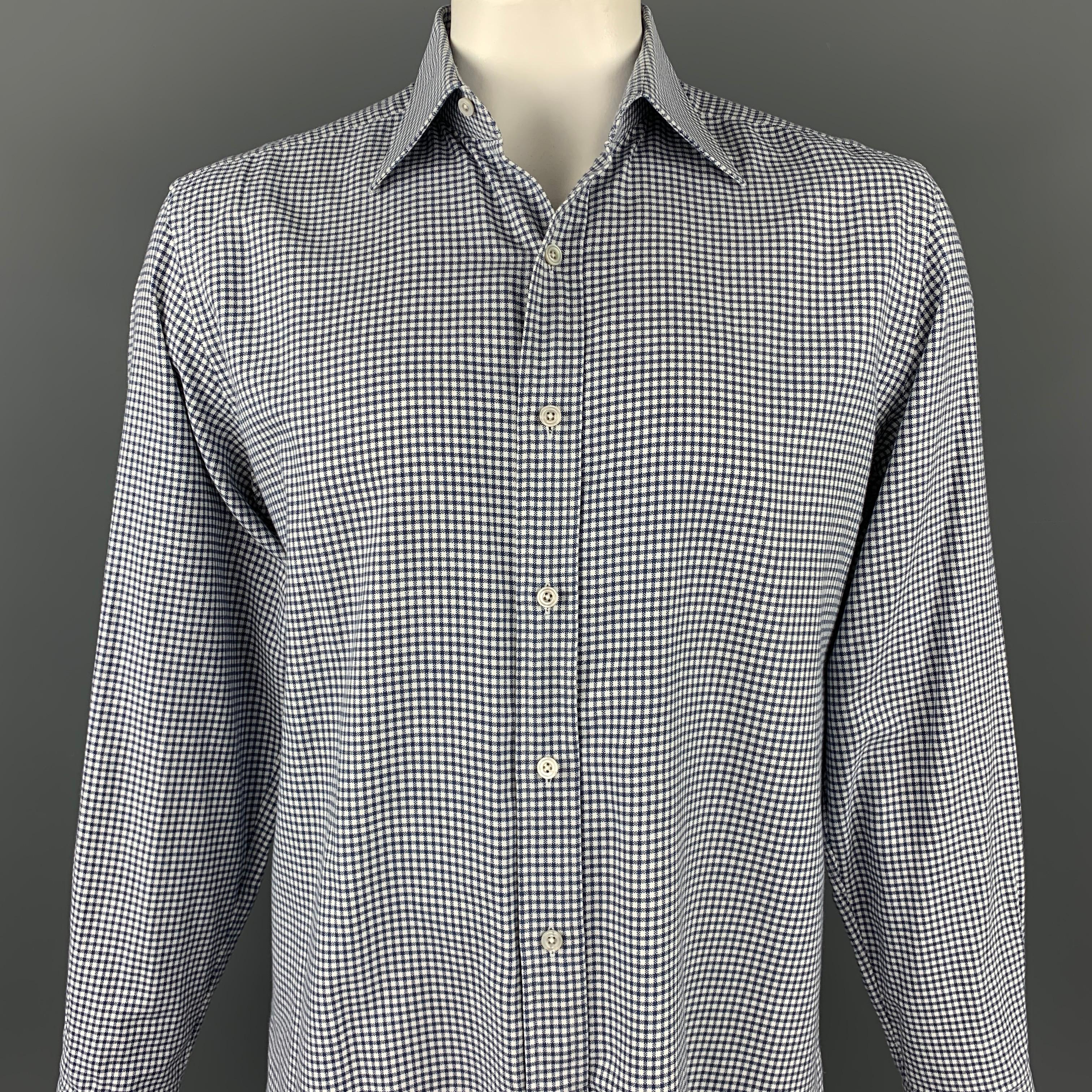 TOM FORD long sleeve shirt comes in a navy & white window pane cotton featuring a button up style and a spread collar. Made in Switzerland.

Very Good Pre-Owned Condition.
Marked: 43/17

Measurements:

Shoulder: 19 in.
Chest: 48 in.
Sleeve: 27