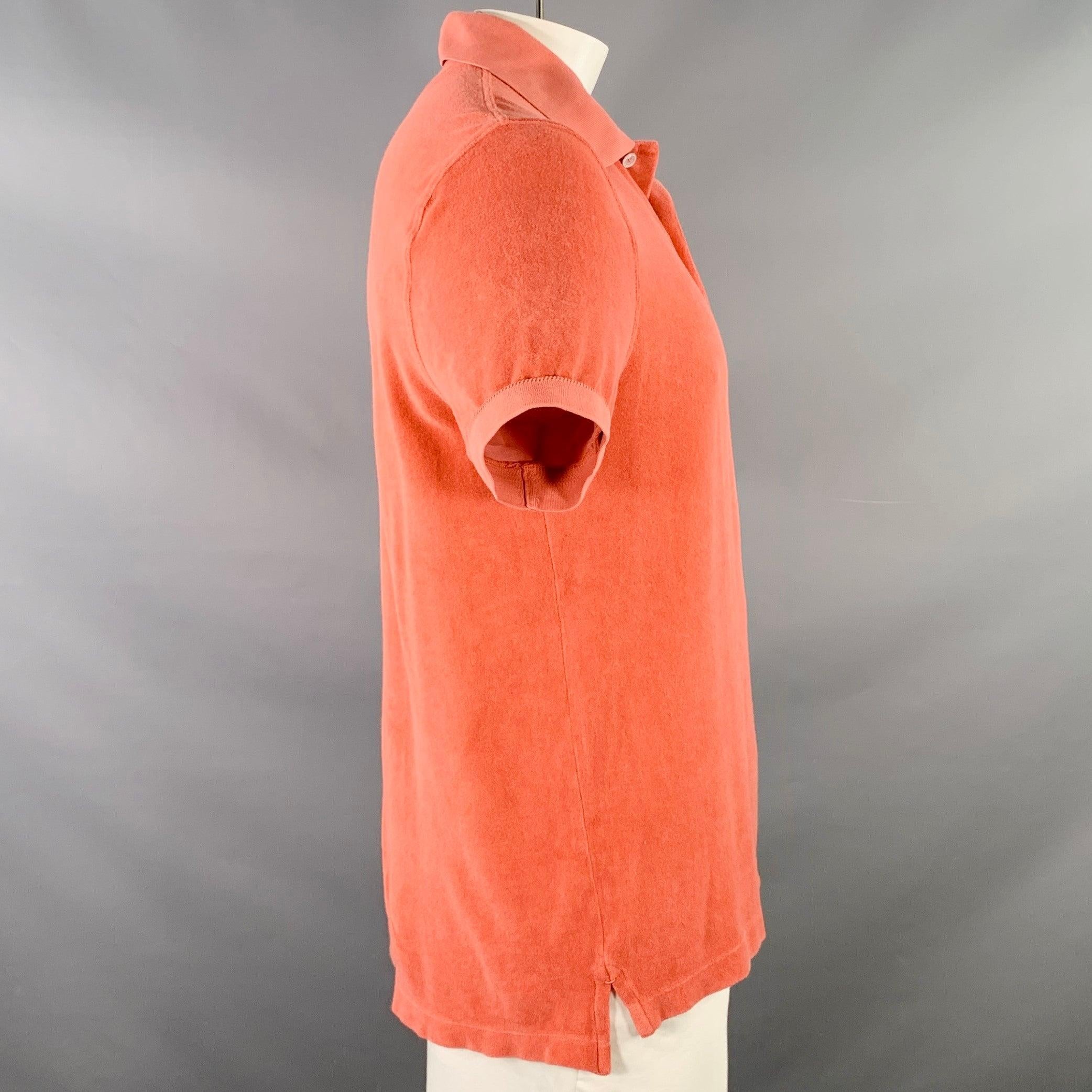 TOM FORD polo
in an orange cotton blend terry featuring rib knit trim, short sleeves, and half placket button closure. Made in Portugal.Very Good
 Pre-Owned Condition. Minor snags and signs of wear. 

Marked:   IT 54 

Measurements: 
 
Shoulder: