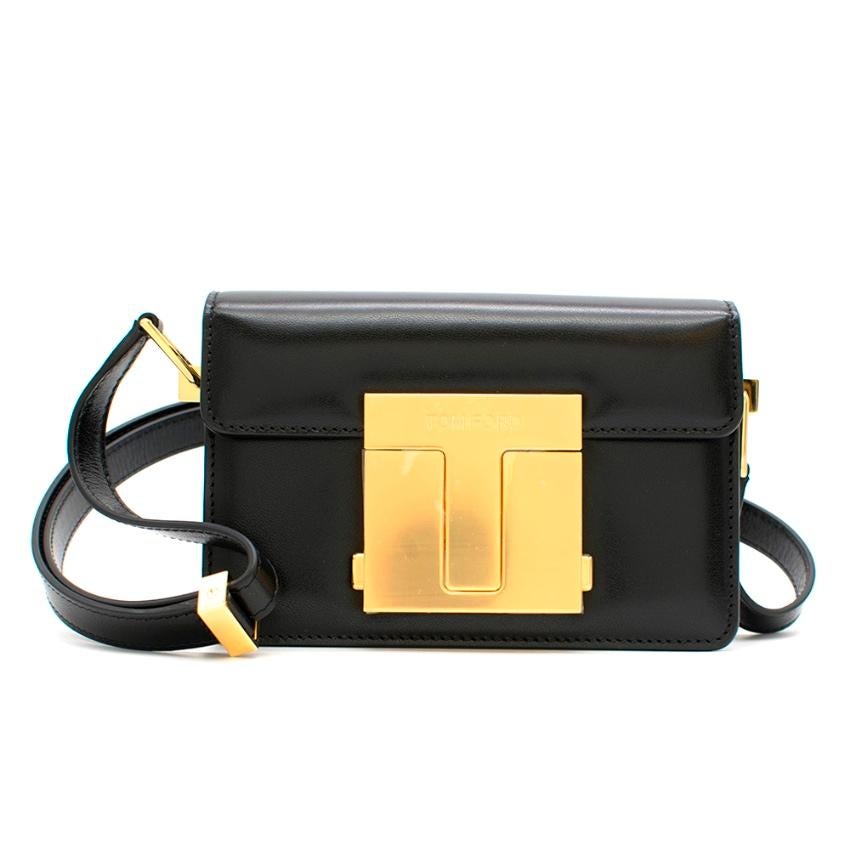 Tom Ford Small T Clasp Shoulder Bag

T shaped gold closure - adjustable strap - internal pockets
Brand new in box

Please note, these items are pre-owned and may show signs of being stored even when unworn and unused. This is reflected within the