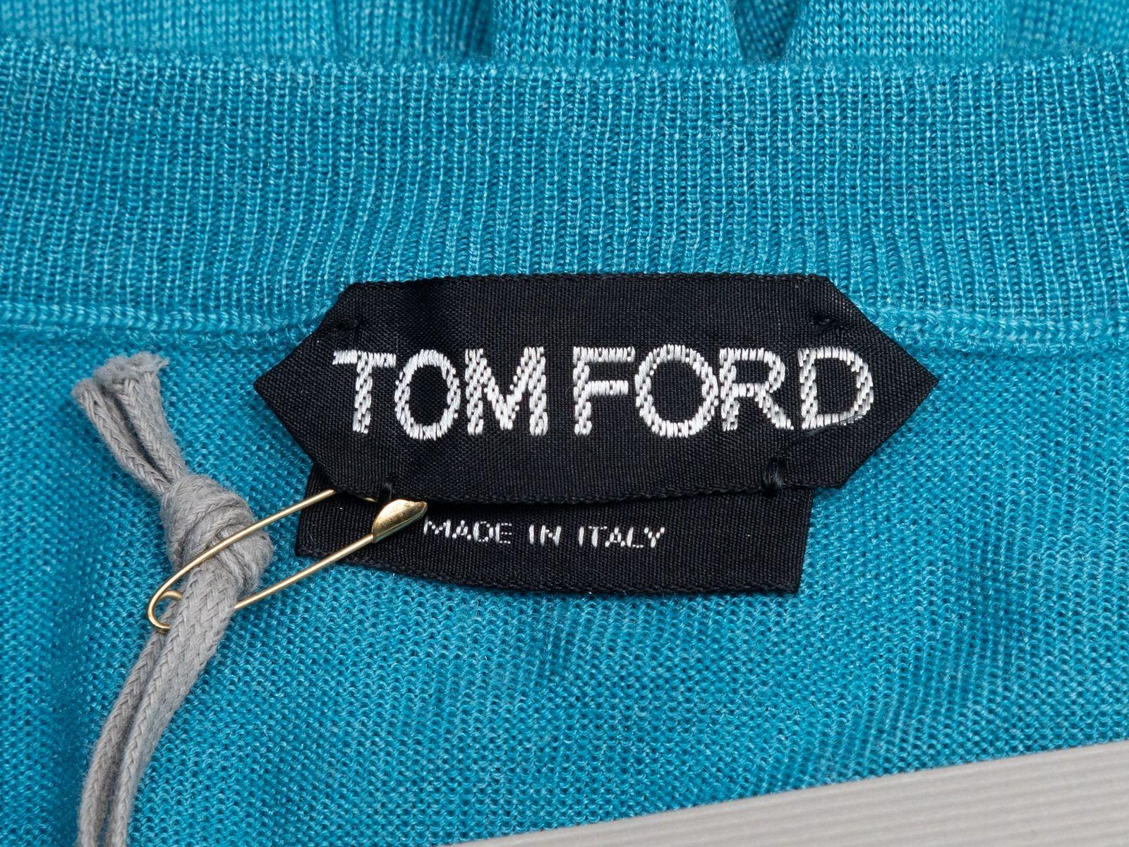 Product Details: Teal cashmere and silk-blend top by Tom Ford. Crew neck. Long sleeves. Button closures at bust. 38