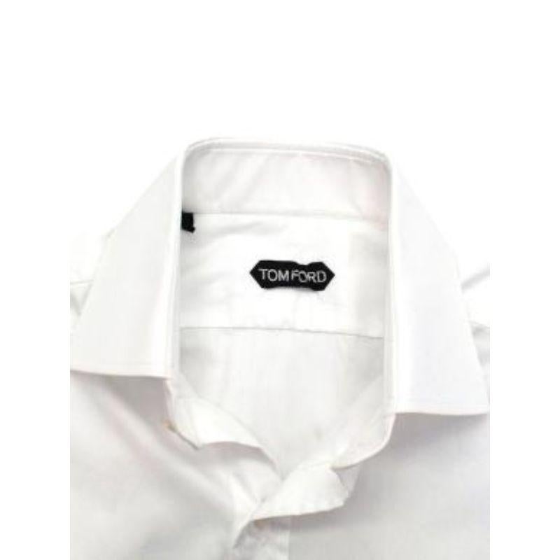 Tom Ford White Cotton Dress Shirt

- Button fastening
- Buttoned cuffs
- Structured collar and cuffs

Material
100% Cotton

Made in Switzerland

9.5/10 Excellent condition

PLEASE NOTE, THESE ITEMS ARE PRE-OWNED AND MAY SHOW SIGNS OF BEING STORED