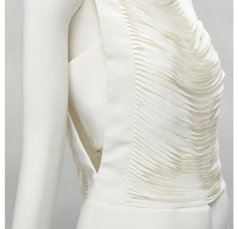 TOM FORD white laser cut fringe polyester vest bandeau set top IT42 S
Reference: JACG/A00021
Brand: Tom Ford
Designer: Tom Ford
Material: Polyester
Color: White
Pattern: Solid
Closure: Zip
Lining:  Silk
Extra Details: Laser cut fringe at front and