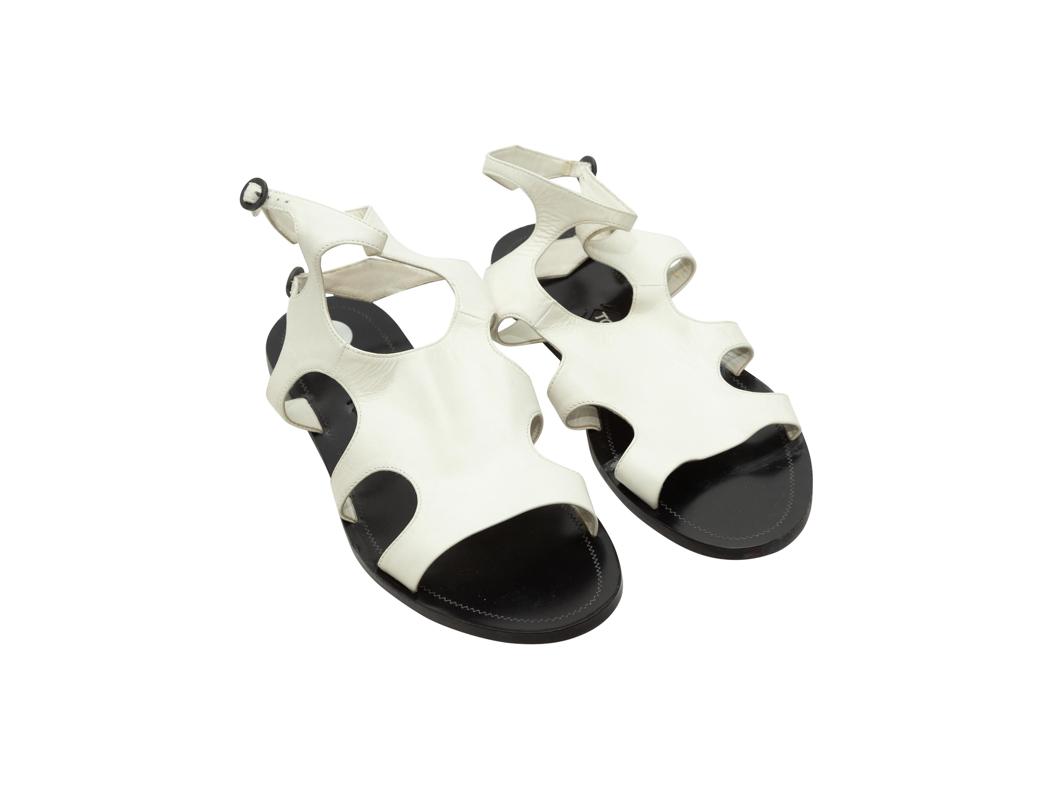 Product details: White leather cutout sandals by Tom Ford. Dual buckle closures at ankle straps. Designer size 39.
Condition: Pre-owned. Very good. Faint wear at soles.
Est. Retail $ 695.00