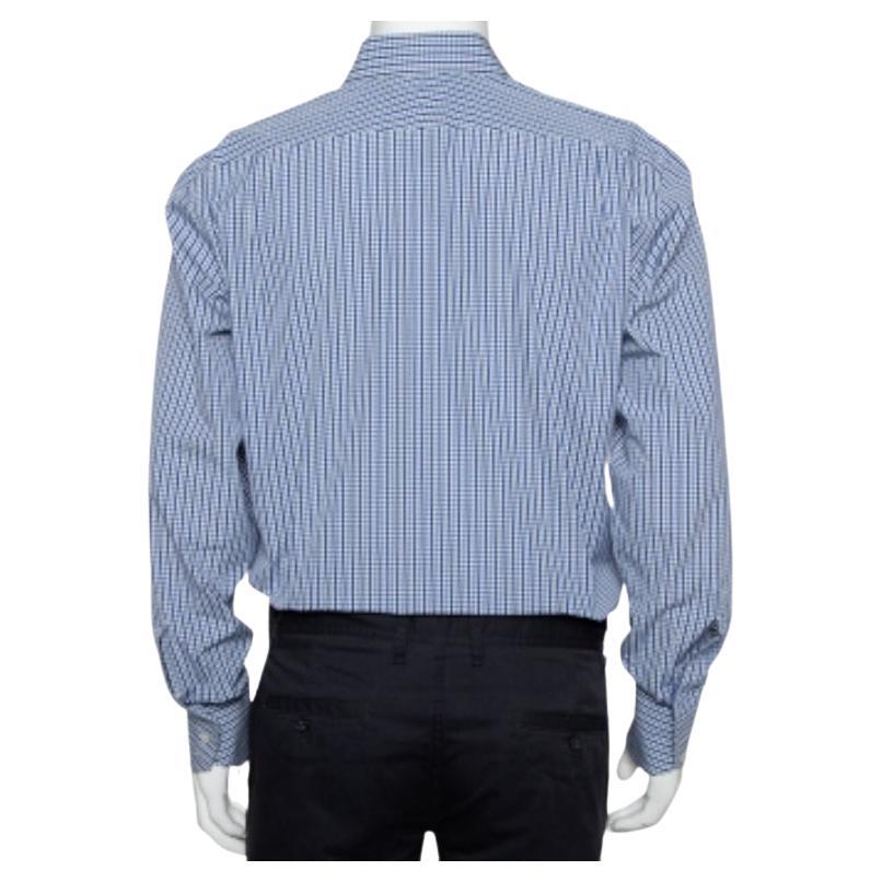 Cut out from 100% cotton, this Tom Ford shirt with navy blue and white checks will light up your formal look. The button front shirt features a classic collar and buttoned cuffs. Pair this with dark formal trousers for a perfect office ensemble.