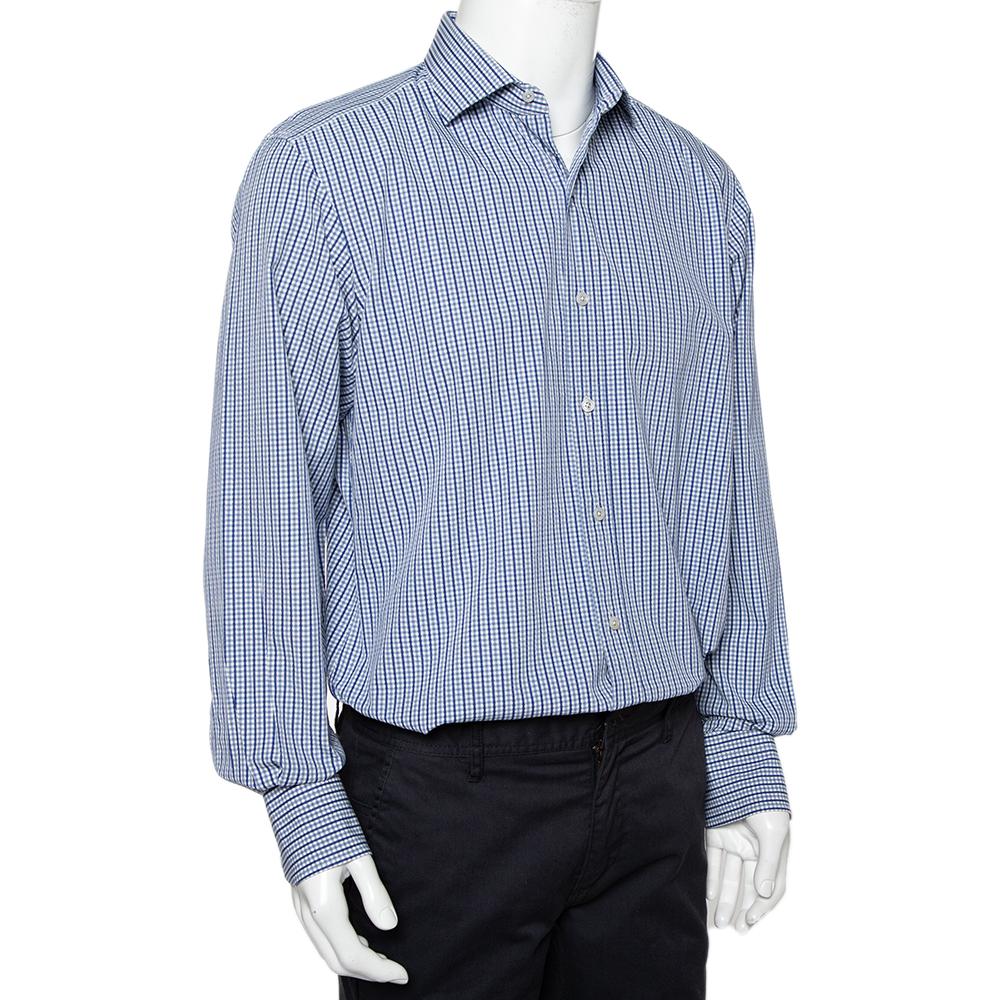 Cut out from 100% cotton, this Tom Ford shirt with navy blue and white checks will light up your formal look. The button front shirt features a classic collar and buttoned cuffs. Pair this with dark formal trousers for a perfect office ensemble.

