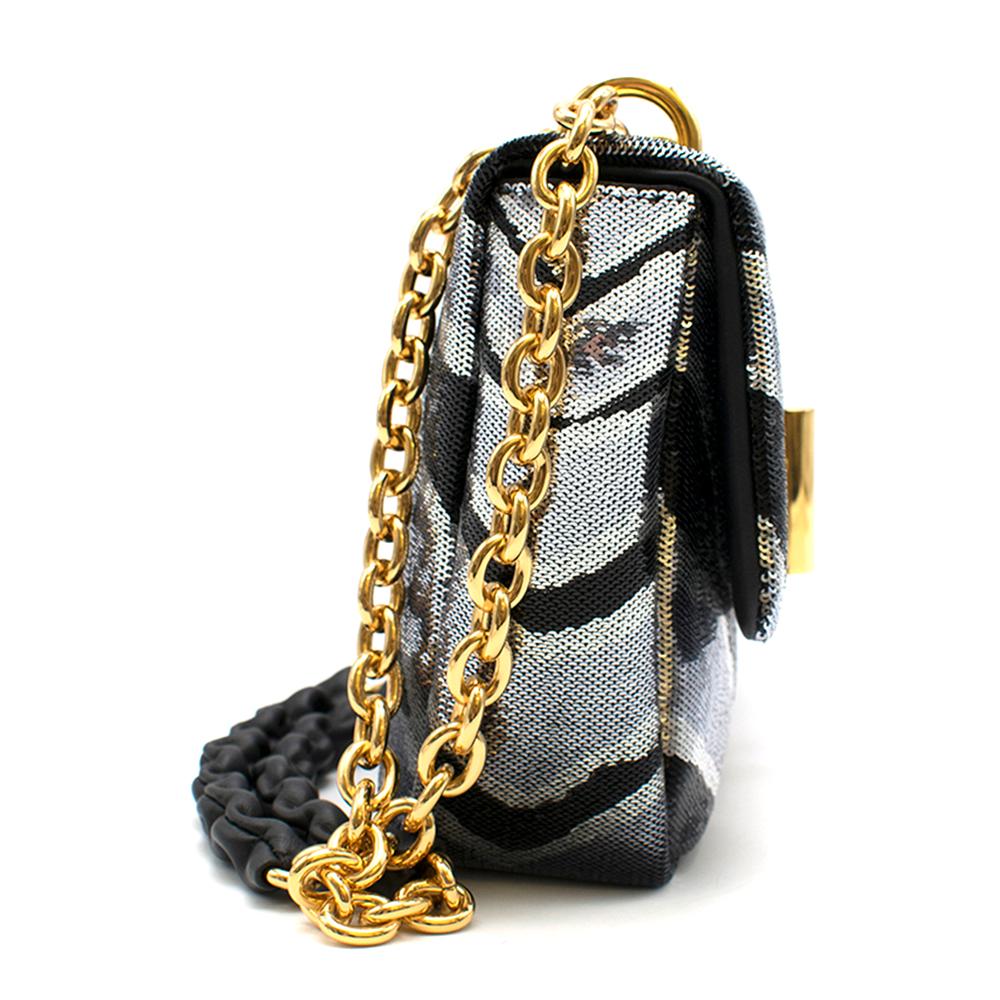 Tom Ford shoulder bag in allover zebra sequins with golden hardware. Features a sliding chain and a leather shoulder strap.

- Adjustable chain strap
- Black leather interior
- Internal card slot
- Turn lock closure

Composition:
Second Leather: 
-