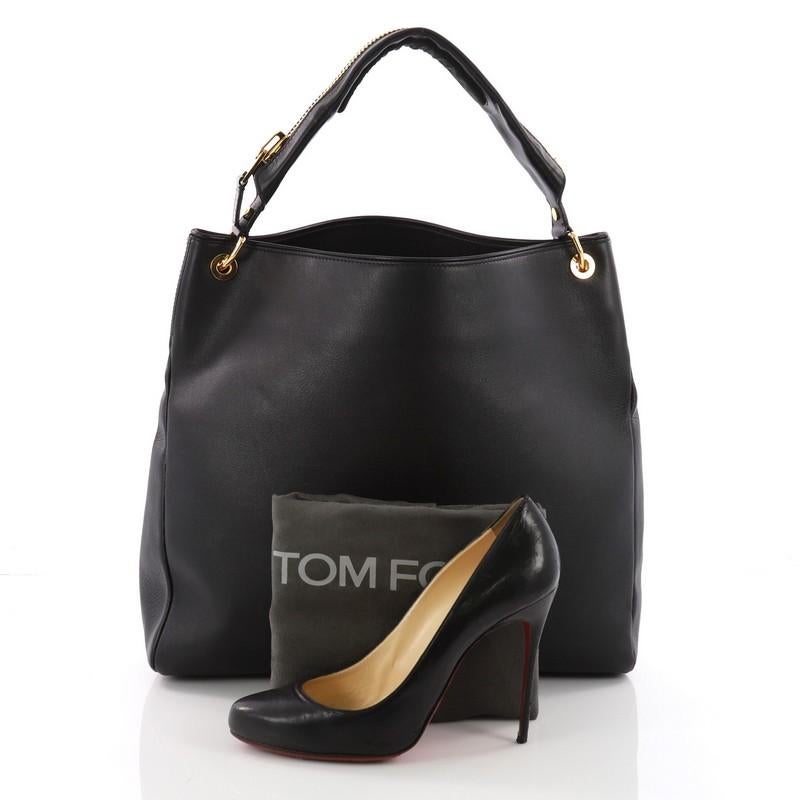 This Tom Ford Zipper Strap Hobo Leather, crafted from black leather, features a single leather looped handle with zipper details and gold-tone hardware. Its wide open top showcases a black microfiber interior with side zip pocket. **Note: Shoe