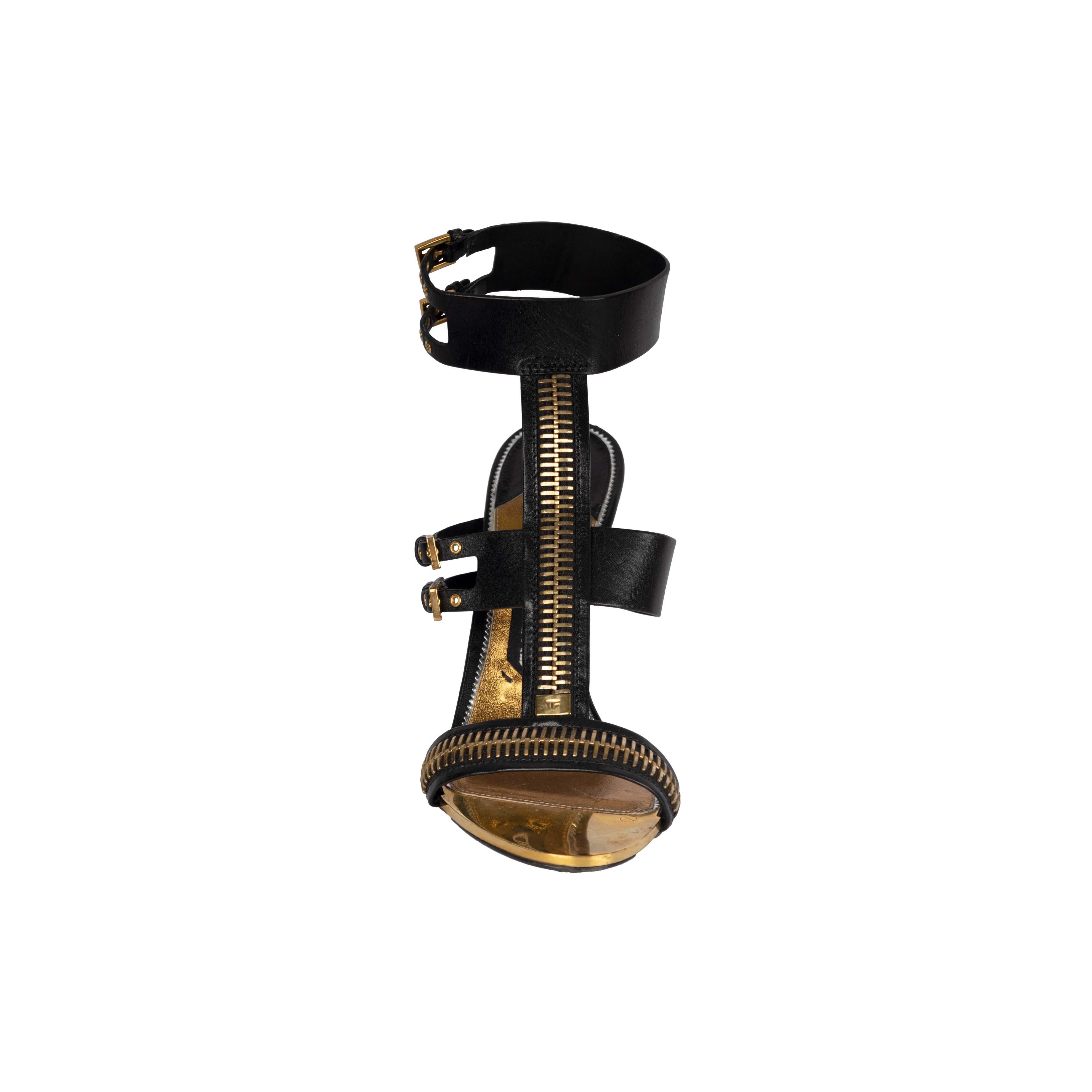 Embellished with golden zipper, buckles, and eyelets, the Tom Ford Zipper T-Strap Sandals is a rare piece that elevates the simplest looks and adds peak '80s glamor to your extraordinary ensemble.

Insole Length - 25 cm
Heel - 10 cm