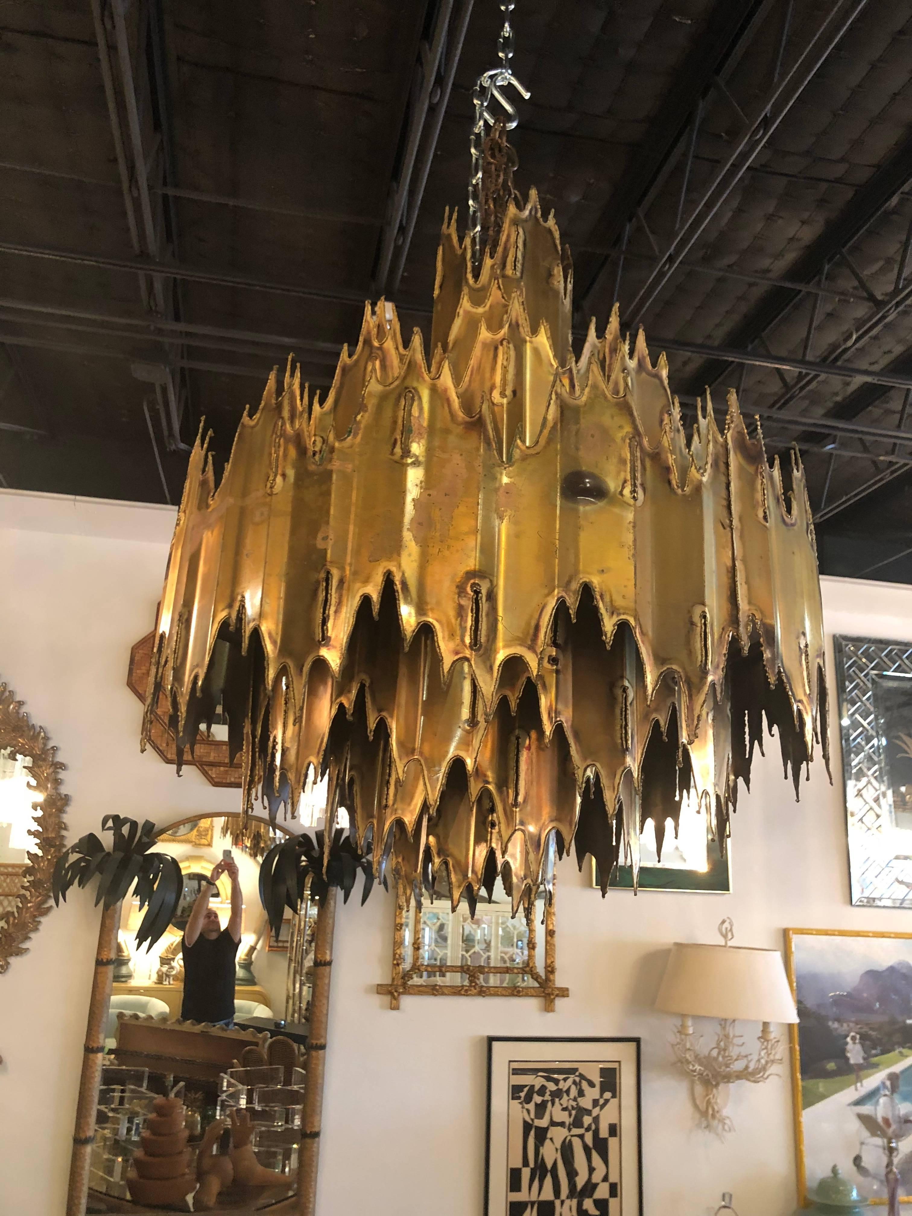 Vintage Brutalist Tom Greene for Feldman torch cut chandelier, seven tiers, seven lights. Comes with chai. But does not come with ceiling cap.