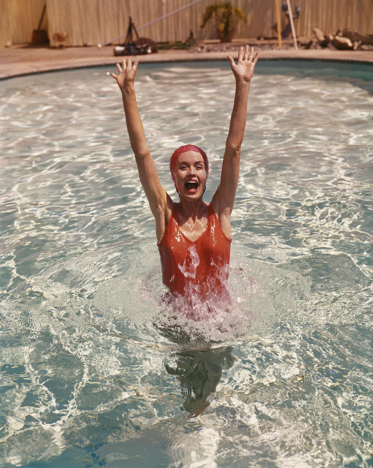 Tom Kelley Color Photograph - Young Woman in Swimming Pool 