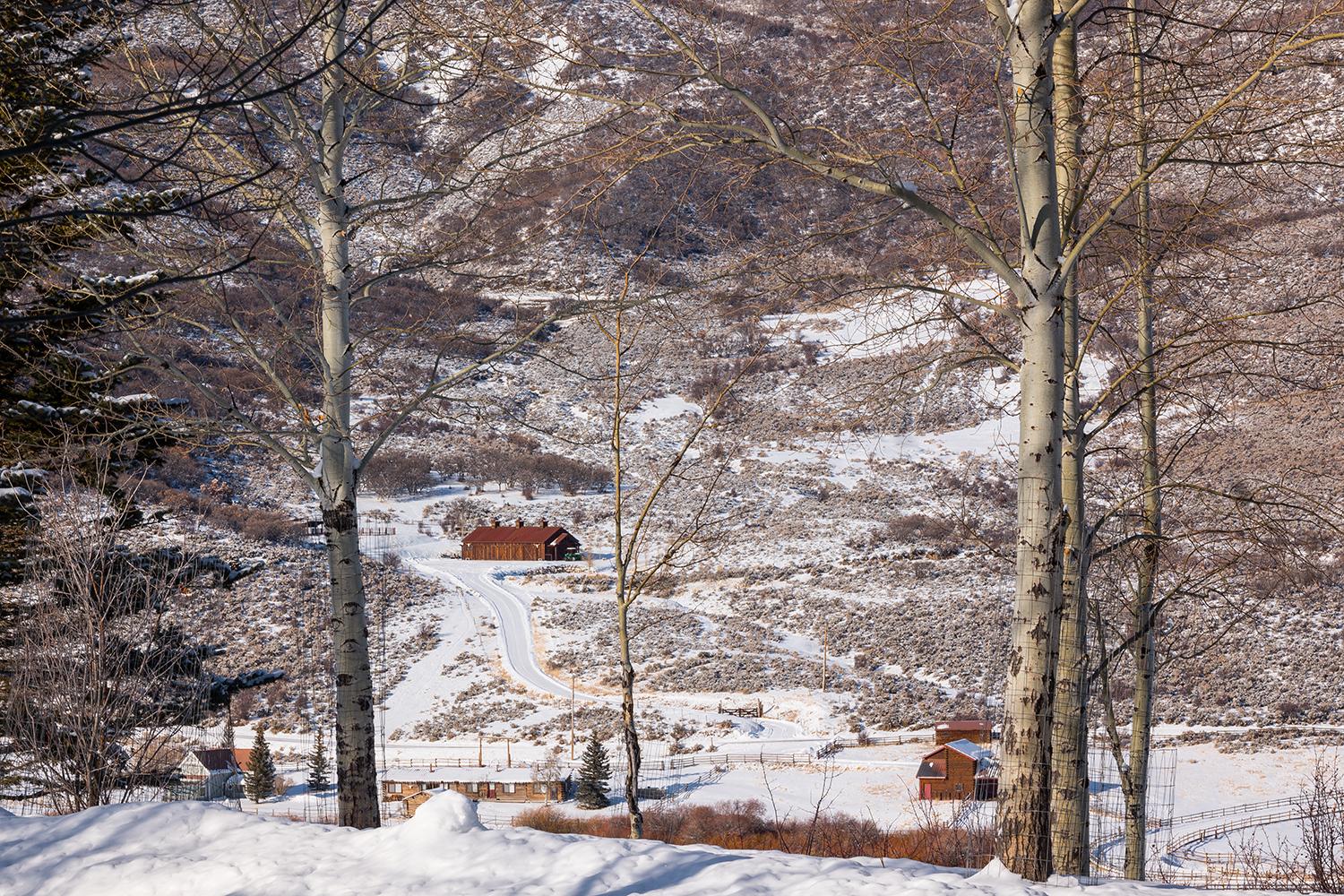 Tom Korologos Landscape Photograph - High in the Hills (snow, mountain retreat, barn)