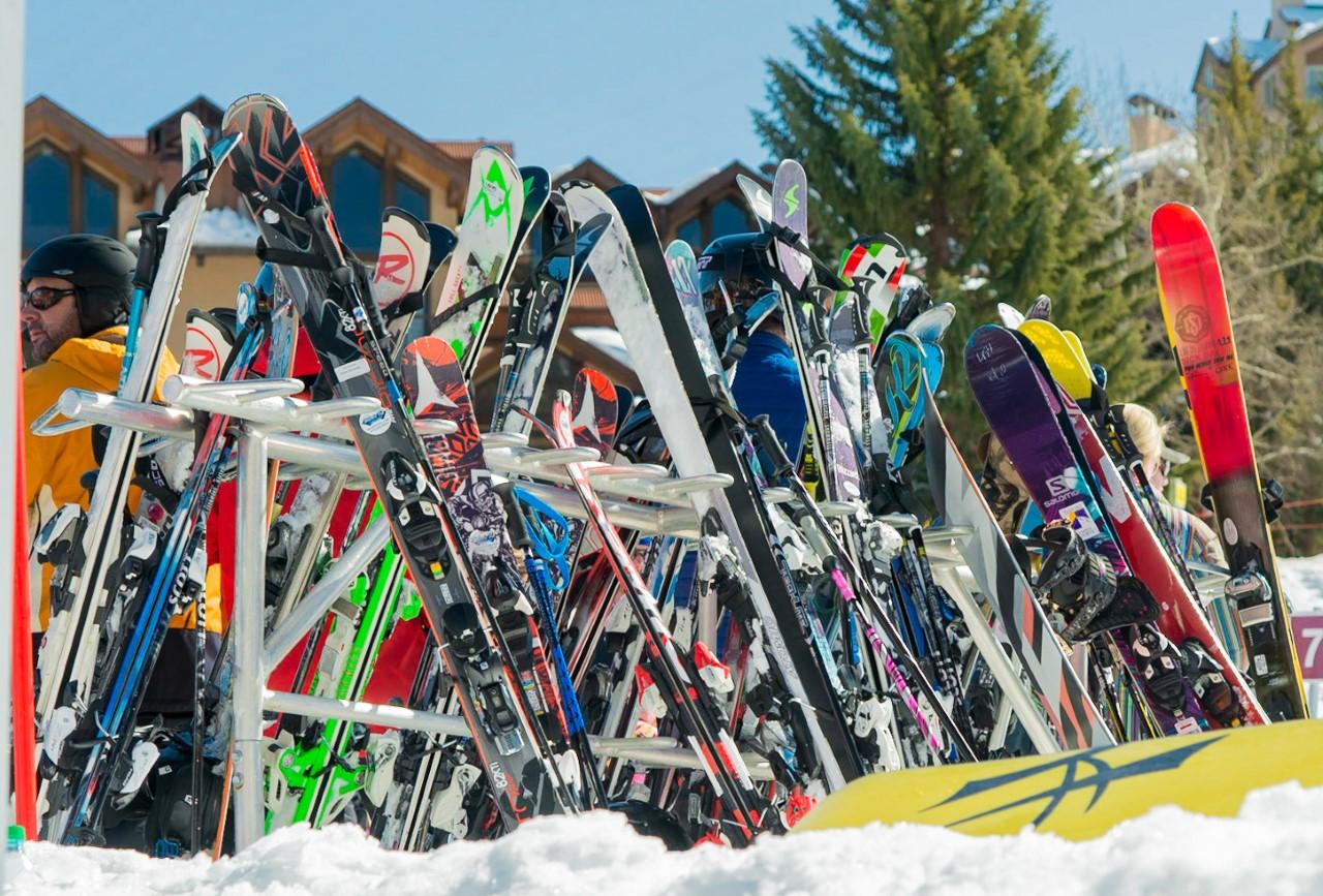Tom Korologos Color Photograph - Snowmass Ski Mayhem 2 (ski rack, vibrant graphics, brilliant blue sky)