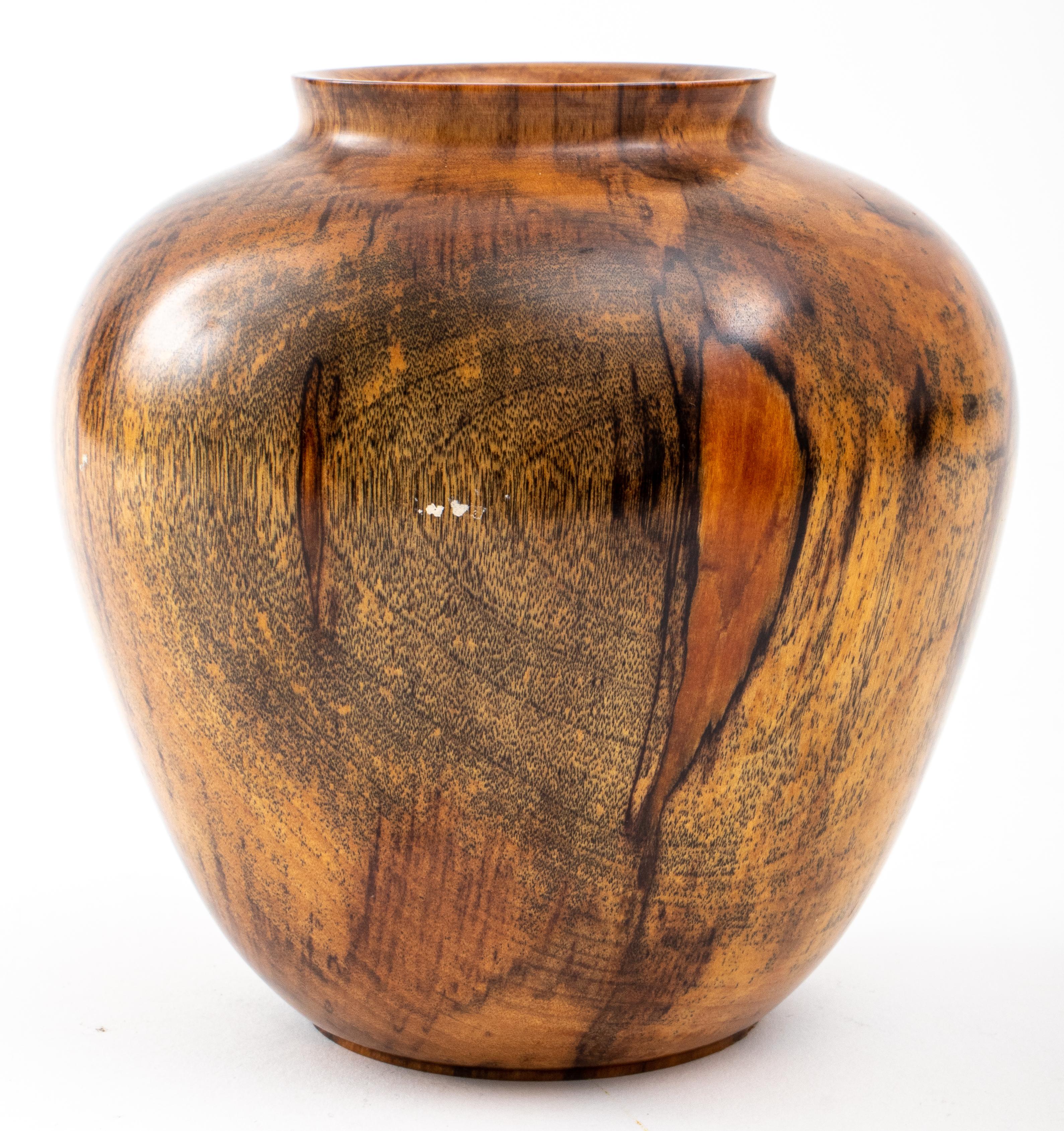 Tom Laser (American, 1938 - 2021), a turned black birch vase, signed on base 