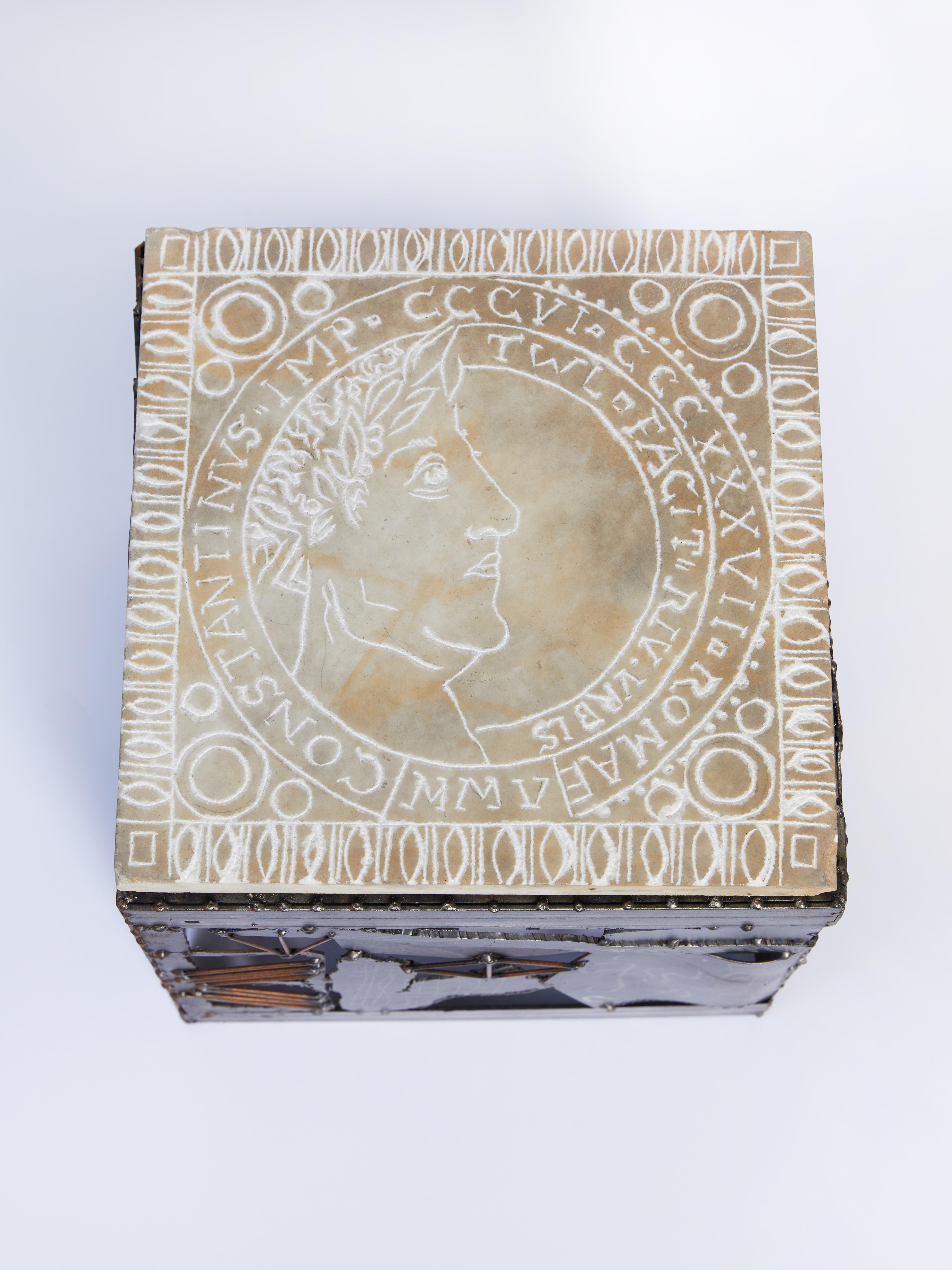 Contemporary artists Tom Lollar and Ricardo Arango's Agrippa and Constantine Cube Tables. They are hand-carved marble, coin motif drawings of the Roman General Agrippa and Emperor Constantine resting on welded steel bases. Signed and dated on the