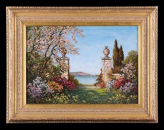 A View of a Lake through Flowers and Blossom '. Antique Painting by Tom Mostyn