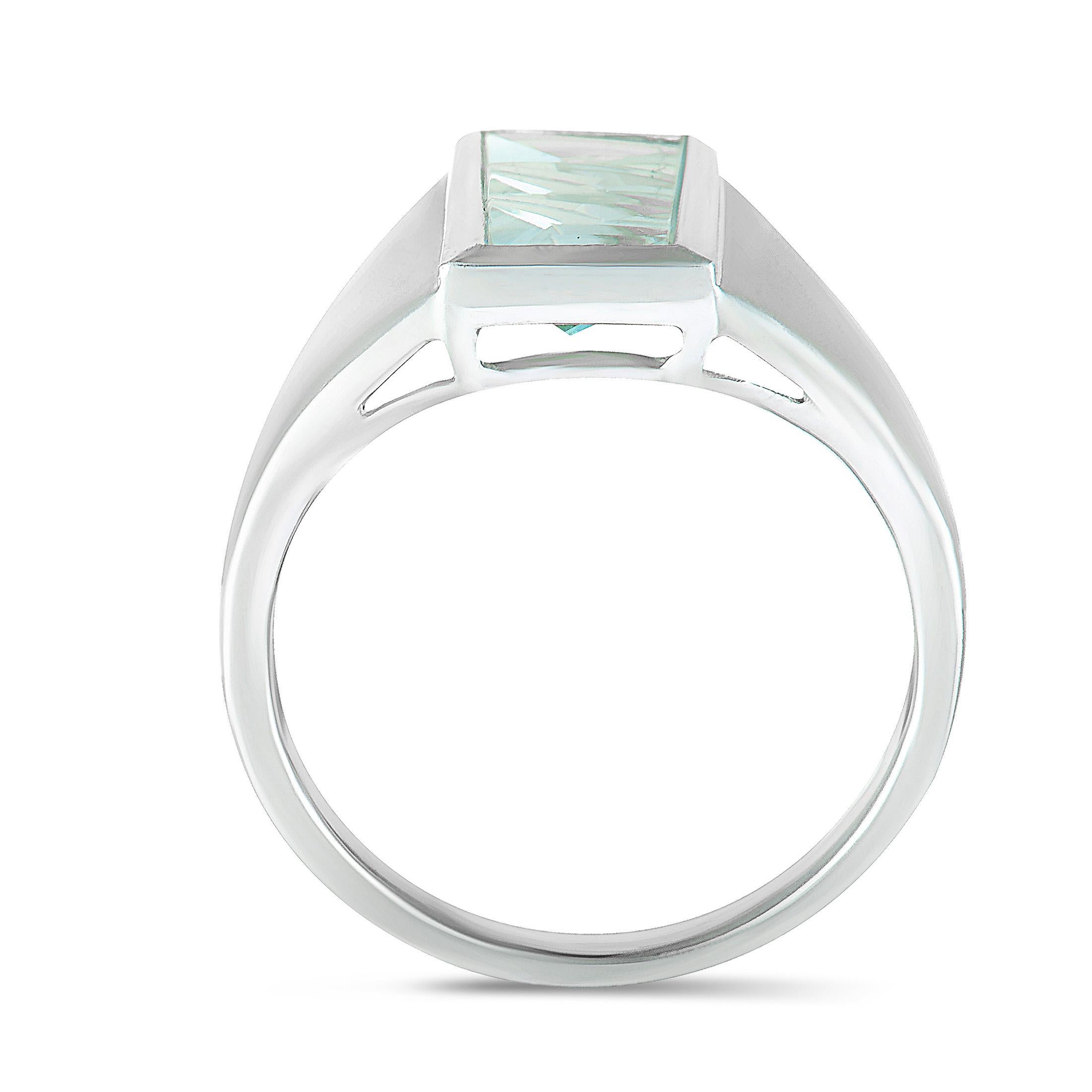The elegant gleam of 18K white gold is given a sublime touch of enticing glisten by the expertly cut aquamarine in this extraordinarily stylized jewelry piece designed by Tom Munsteiner. The aquamarine weighs 3.10 carats.
Ring Size: 10.75
Included