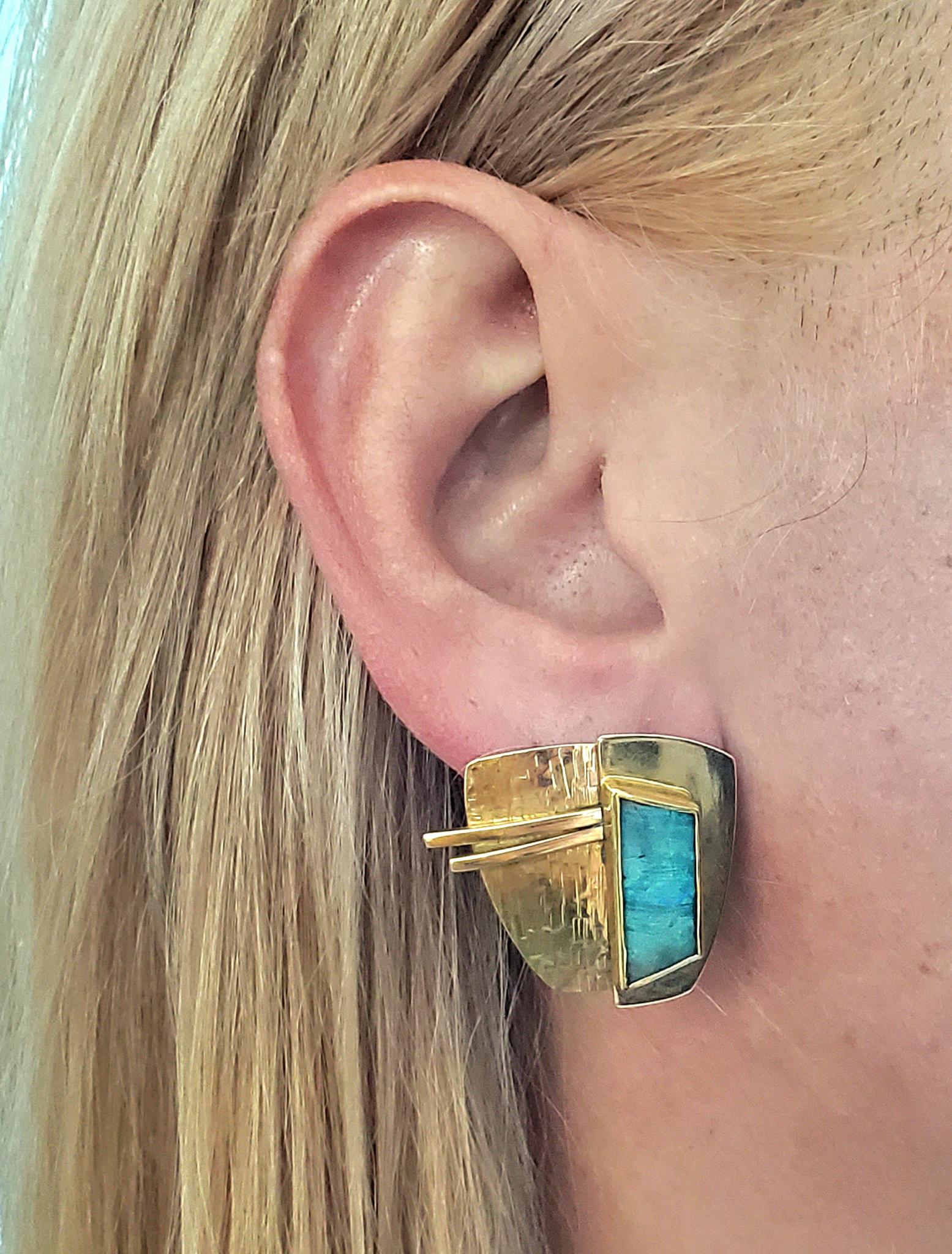 Sculptural earrings designed by Tom Odell.

Fabulous sculptural earrings created in Chattan Massachusett by the studio jewelry artist Tom Odell. This three dimensional geometric earrings has been made with several overlapping elements crafted in