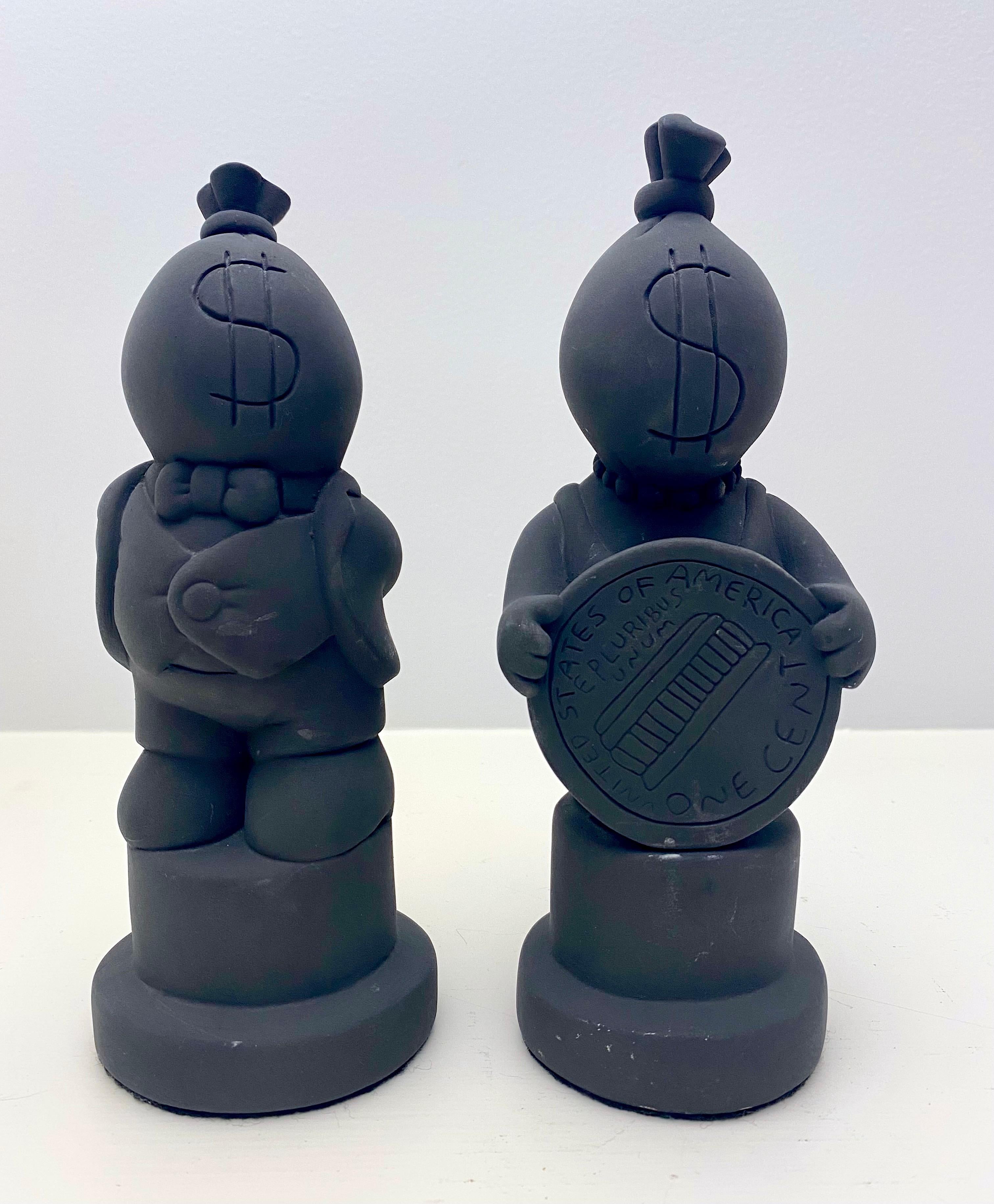 Fun pair of Tom Otterness King and Queen Plaster Sculptures in matte black. Signed on the back. 
Tom Otterness (born 1952) is an American sculptor best known as one of America's most prolific public artists. Otterness's works adorn parks, plazas,