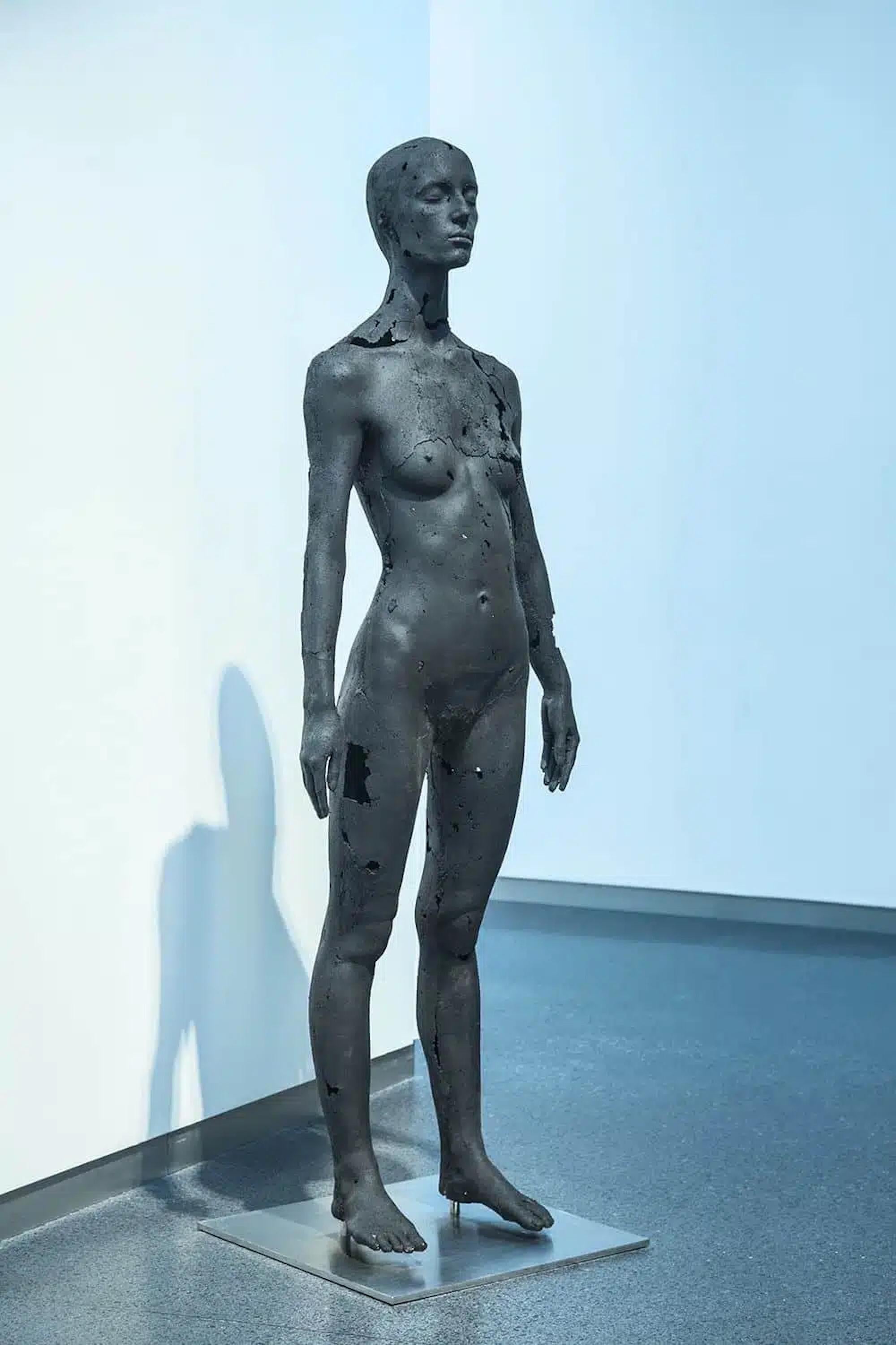 The Presence of Absence – Female (II) is a unique coal, stainless steel and epoxy resin sculpture by contemporary artist Tom Price, dimensions are 170 × 50 × 50 cm (66.9 × 19.7 × 19.7 in). 
The sculpture is signed and comes with a certificate of