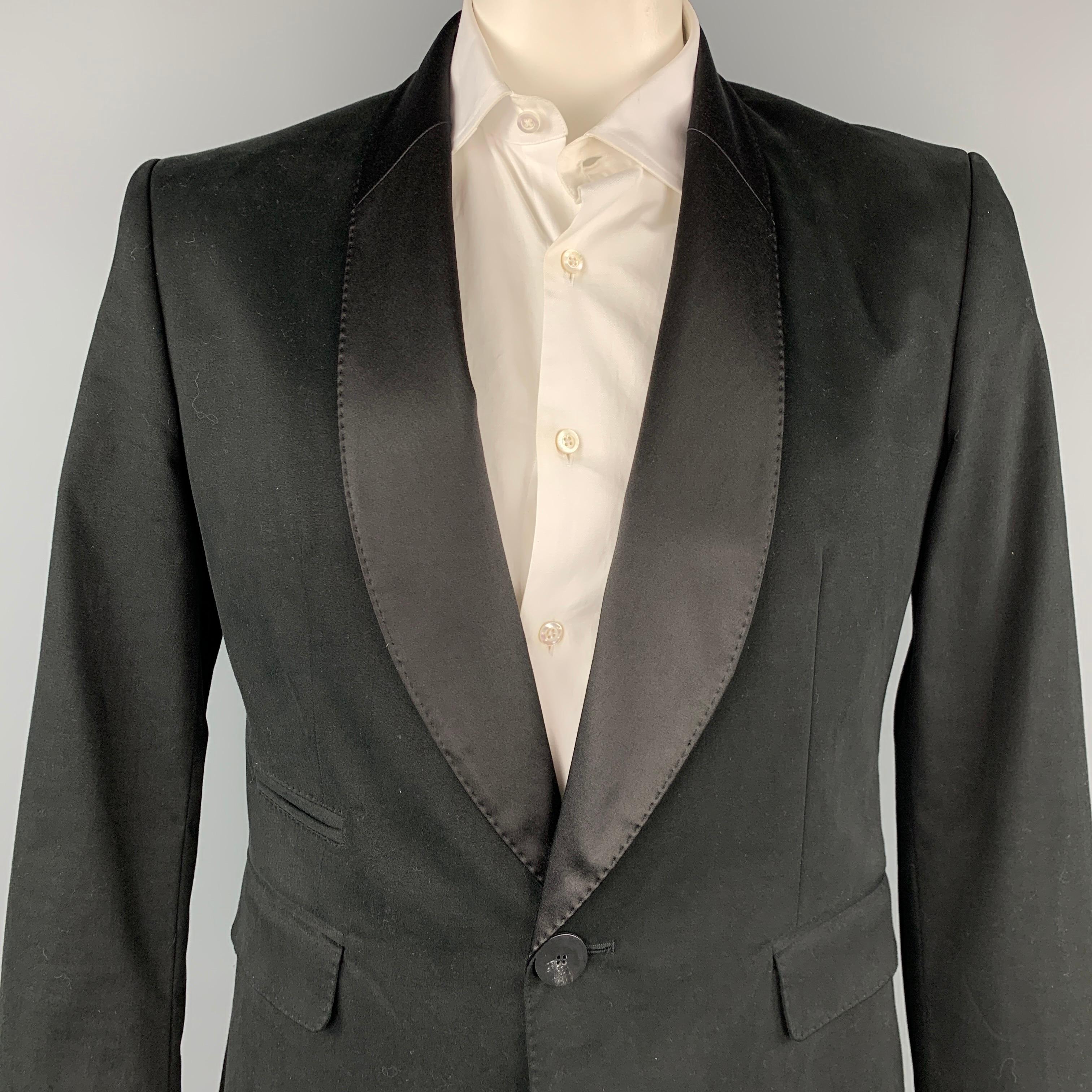 TOM REBL sport coat comes in a black acetate / cotton with a full liner featuring a shawl collar, flap pockets, and a single button closure. Made in Italy.

Very Good Pre-Owned Condition.
Marked: 52
Original Retail Price: